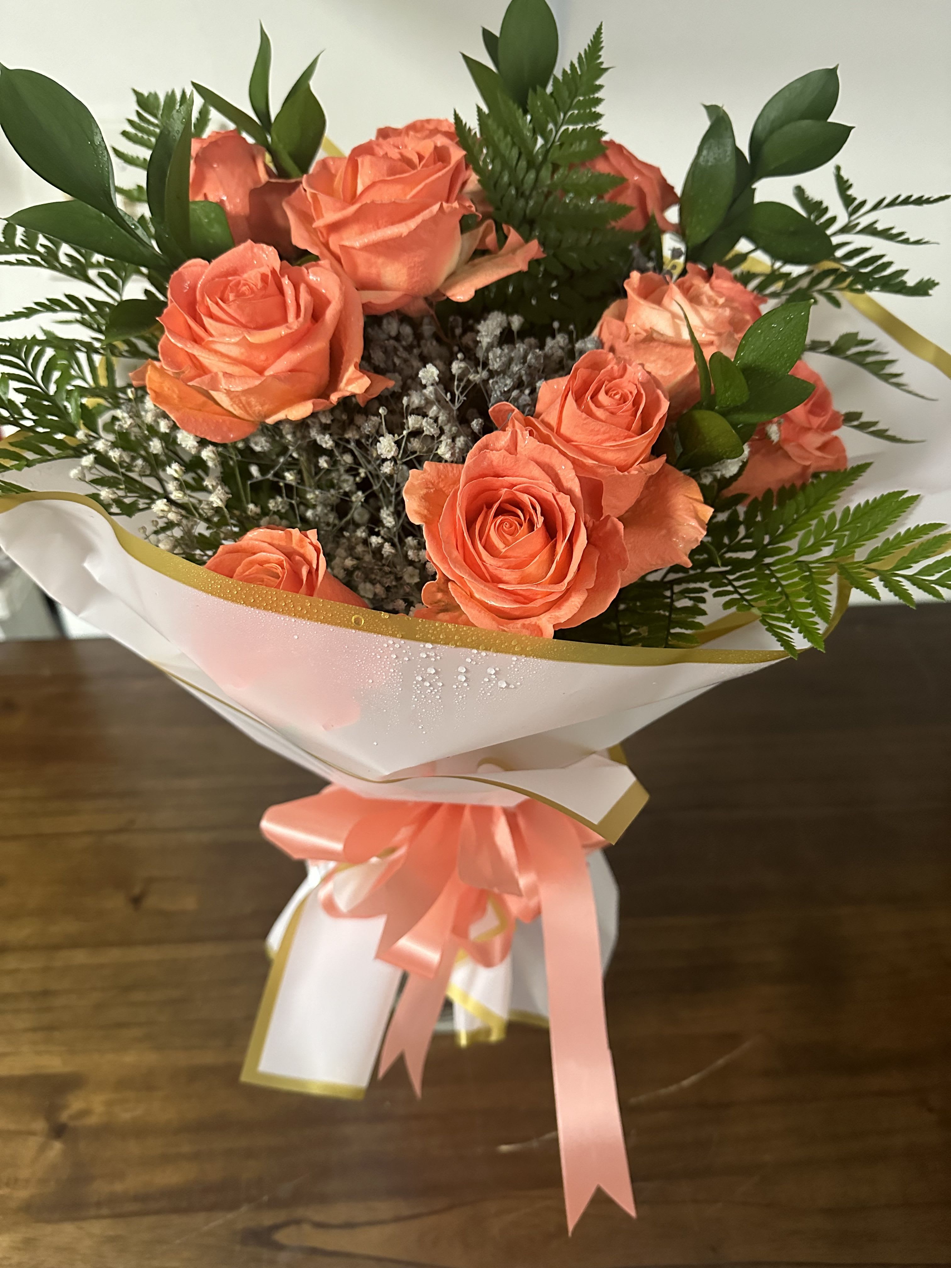 Coral Bouquet - Contains 1 dozen coral roses with filler. No vase. 