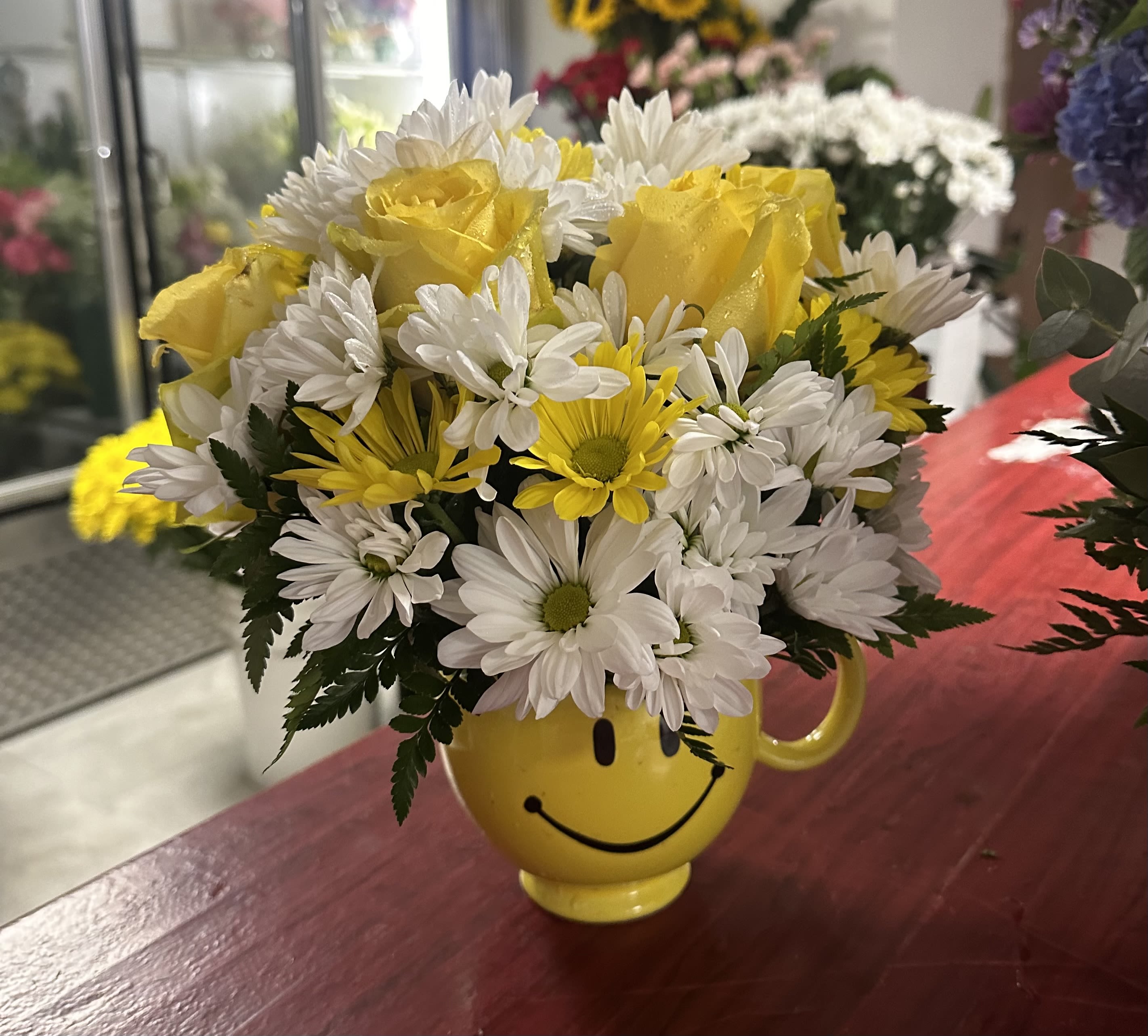 Happy Arrangement - Put a smile on someone's face with this cheerful arrangement featuring a fun mug!