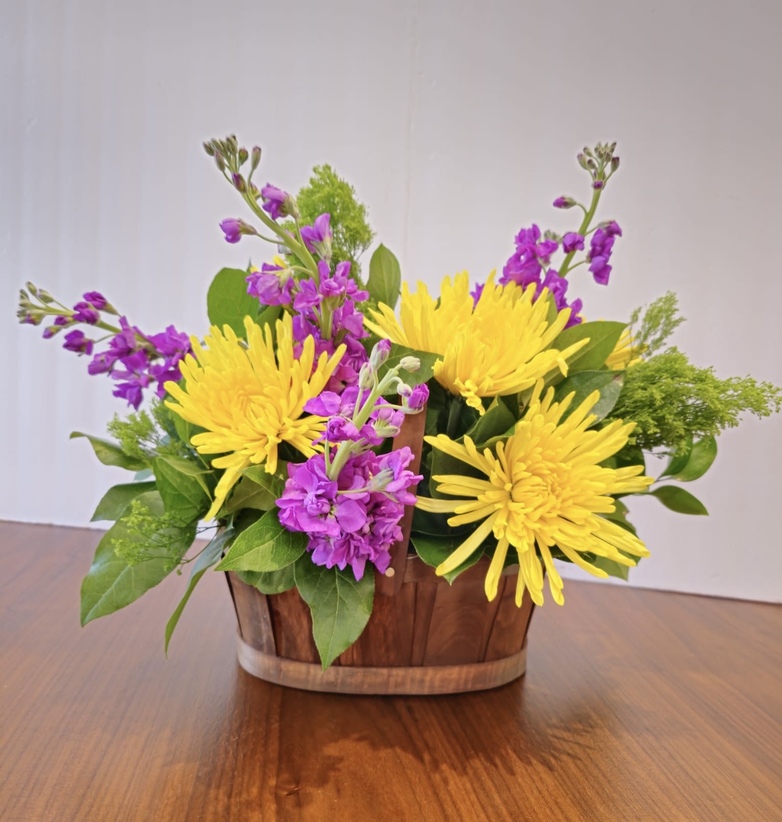 Snappy by BloomNation™ - Snappy by BloomNation™ is a bright and fragrant arrangement featuring yellow mums and purple stock. A great gift option to send for Grandparents Day or to surprise somebody who needs a little cheering up.  Approximate Dimensions: 17&quot;D x 15&quot;H