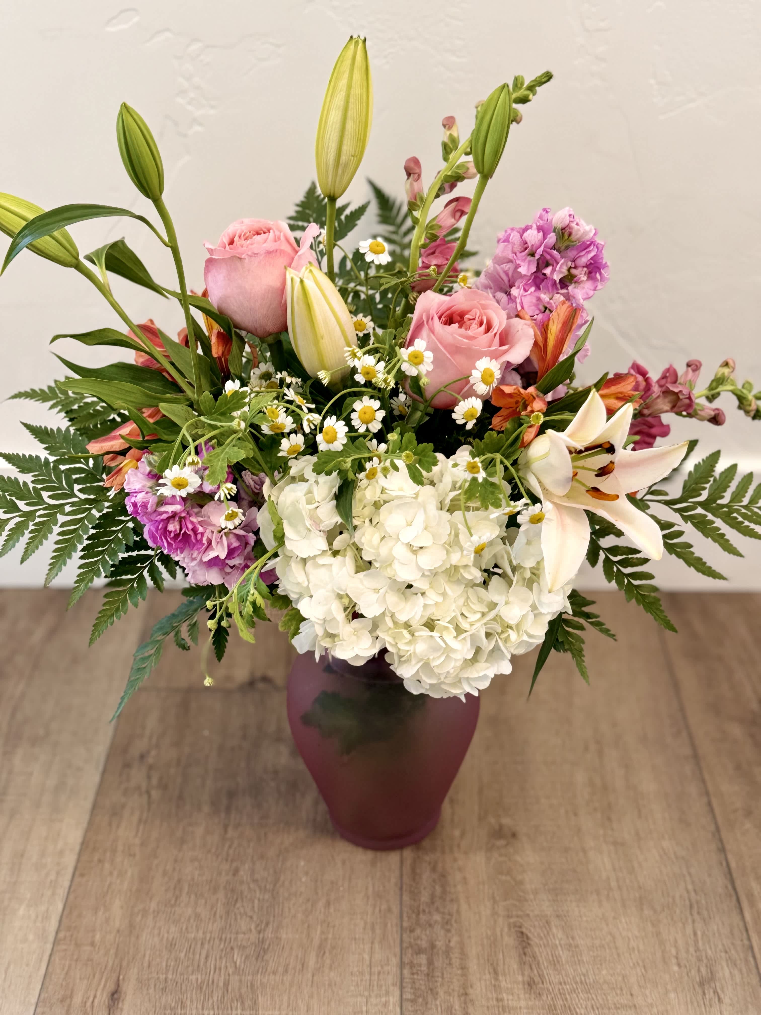 $55 Blooms of Summer $55 Blooms of Summer - This pink vase has our heart! Filled with beautiful flowers it is sure to brighten anyone's day!