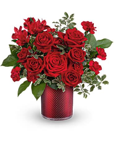 Teleflora's Radiant Crimson Bouquet Teleflora's Radiant Crimson Bouquet - As radiant as your love, this romantic red rose bouquet looks ravishing inside a pearlescent scarlet vase with embossed diamond pattern. This rich bouquet features red roses, red spray roses, red alstroemeria, miniature red carnations, lemon leaf and pitta negra. Delivered in a Scarlet Diamond Cylinder.