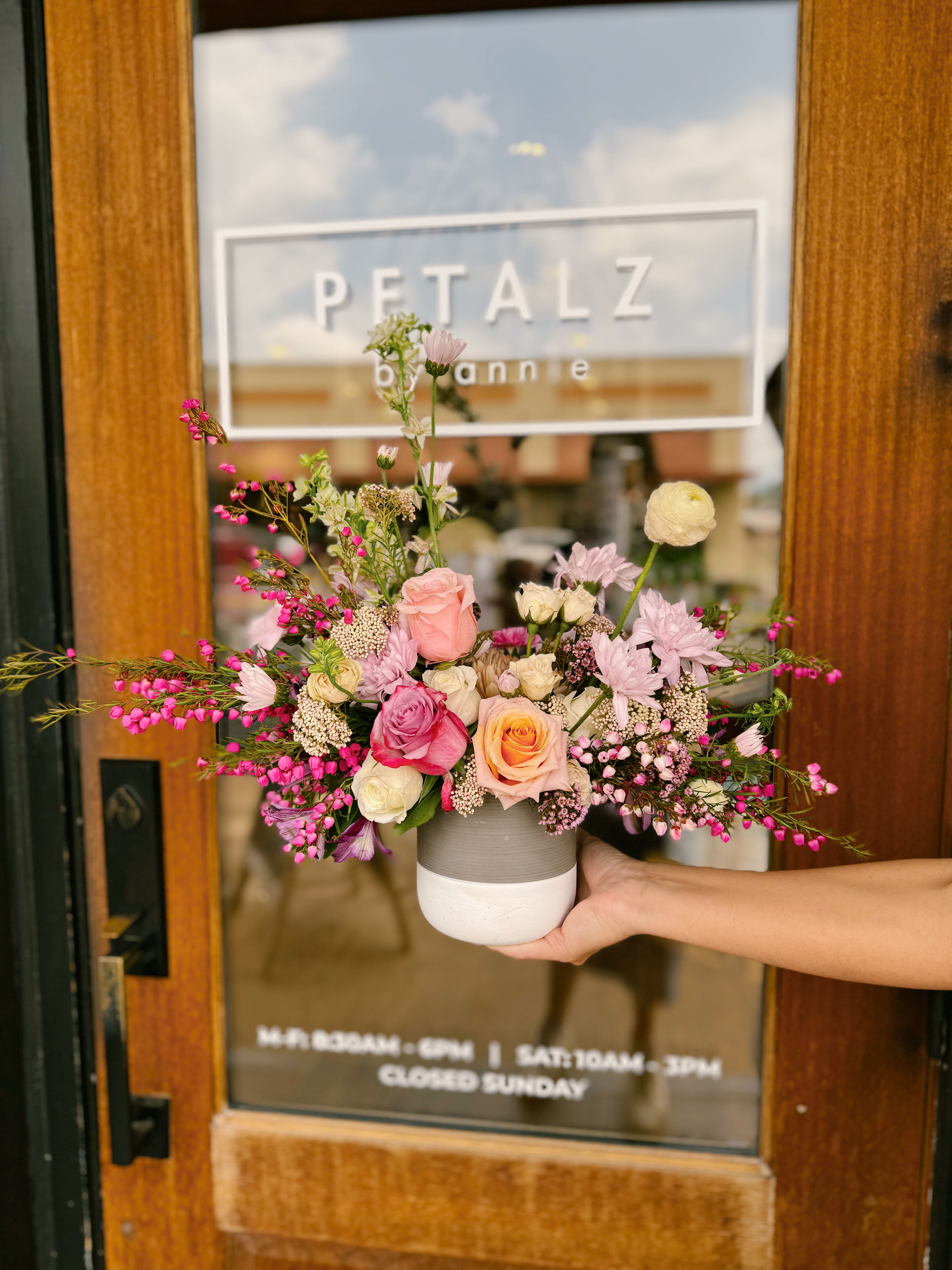 Eternal Sunshine  - This arrangement is uniquely crafted with bright and fresh florals. Arrangement and vase may vary depending on product availability.