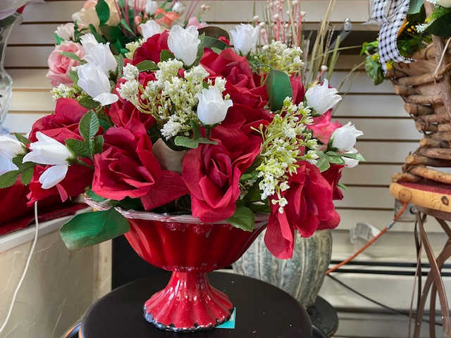 Ruby Blossoms Ruby Blossoms - Each velvety petal of the deep red roses whispers tales of timeless love and devotion.