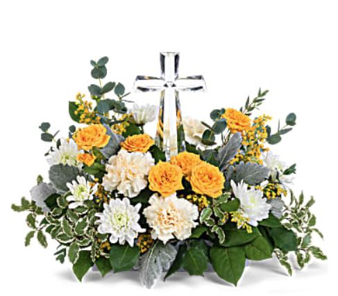 Be the Light - This hopeful arrangement includes yellow spray roses, light yellow carnations, white cushion spray chrysanthemums, yellow solidago, parvifolia eucalyptus, pitta negra, dusty miller and lemon leaf. Delivered with Teleflora's Small Crystal Cross. While supplies last.Approximately 18&quot; W x 12 1/2&quot; H