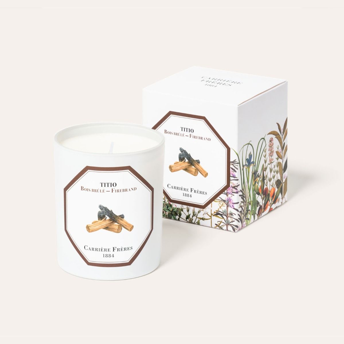 Carrière Frères Scented Candle - Firebrand  - Slash-and-burn agriculture is an ancient practice that has accompanied humanity throughout its history. In antiquity, people would burn wood chips and resins to honour their Gods.  BENEFITS Ideal for the arrival of colder days, its scent brings warmth. Firebrand is known to:  Improve concentration and relaxation,  Help with meditation and yoga,  Eliminate negative energy,  Help to overcome stress and anxiety.  PERFUME A timeless ‘leathery’ fragrance. Reassuring and strengthening, its ancient scent is reminiscent of wood fires, a mixture of dry herbs, and exotic woods.  FEATURES Weight: 185g / 6.5 oz Burning time: 40 to 45 hours Dimensions: H: 9 cm Ø: 7.5 cm  