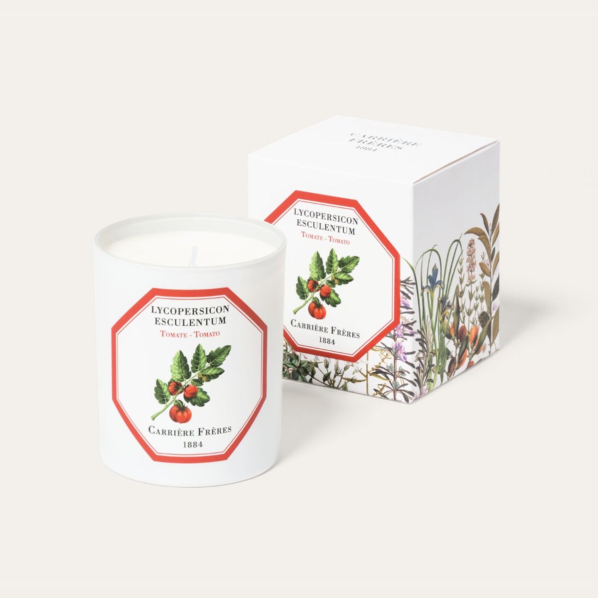 Carrière Frères Scented Candle - Tomato - The tomato, a berry of the Solanaceae family, is one of the most popular fruits in the world. Few people know that it was first grown in South America and that its name comes from the Inca “to malt.” Sweet and fleshy, whether in the fruit basket or veggie pot, the tomato agrees with our palates, but not all palates agree on how to pronounce it. I say tomato…  BENEFITS To be consumed without moderation. Surprising, unusual, and indulgent, its fragrance can be enjoyed all year round. The tomato is known for purifying and cleaning the air.  PERFUME Its vegetable flavor, both tangy and sweet, evokes indulgence. Its green note places it in the heart of a field, where the ripest are ready to be picked.  FEATURES Weight: 185g / 6.5 oz Burning time: 40 to 45 hours Dimensions: H: 9 cm Ø: 7.5 cm  