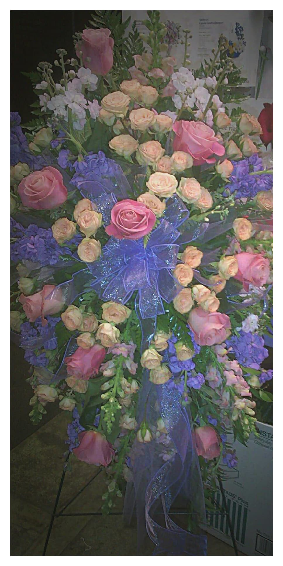 Fields of Roses - Standing spray of beautiful Roses, Spray Roses, Stock, and various filler with ribbon. 