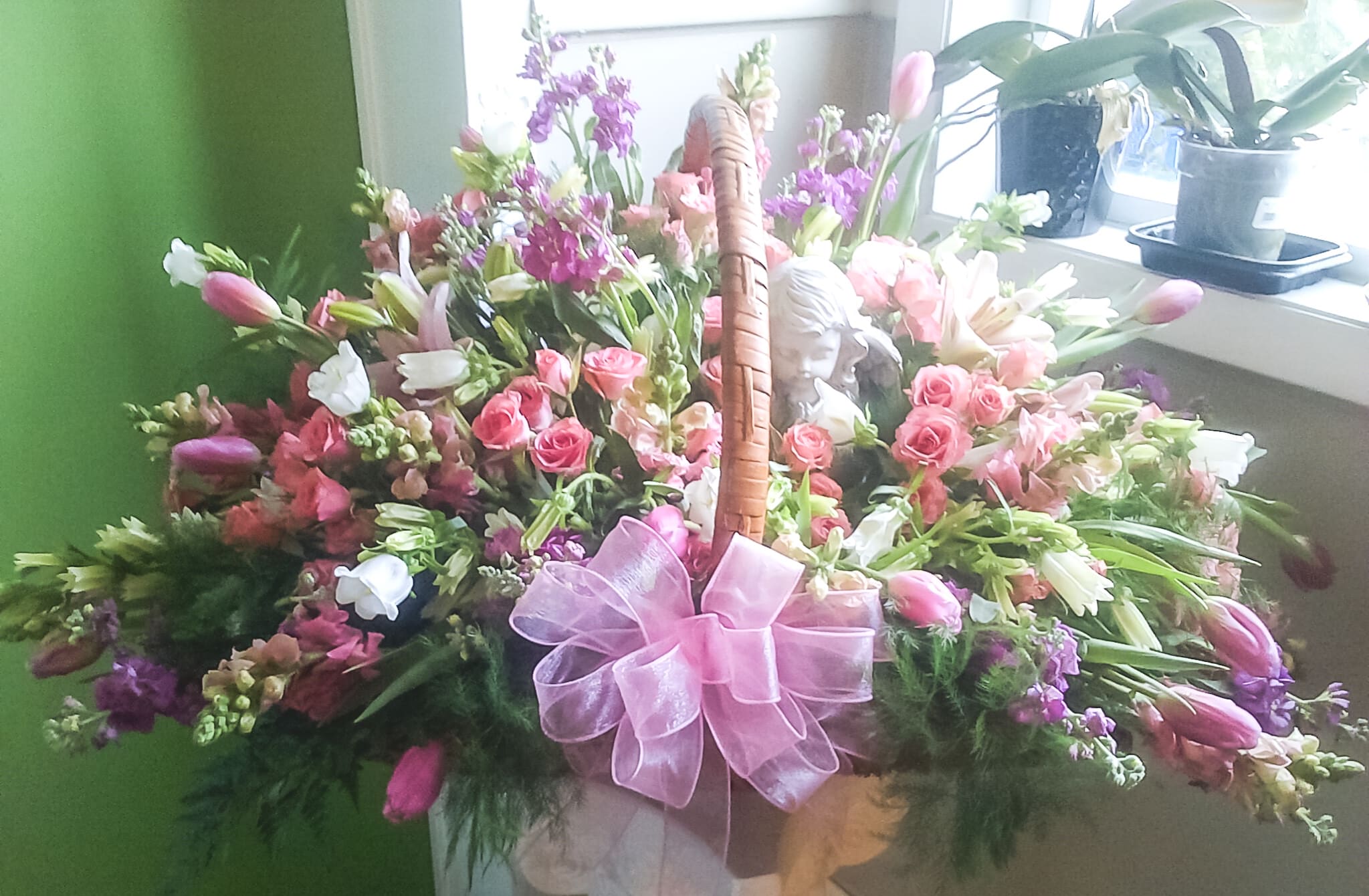 Juliana - Basket overflowing with Spray Roses, Tulips, Campanula, Stock, and various filler 