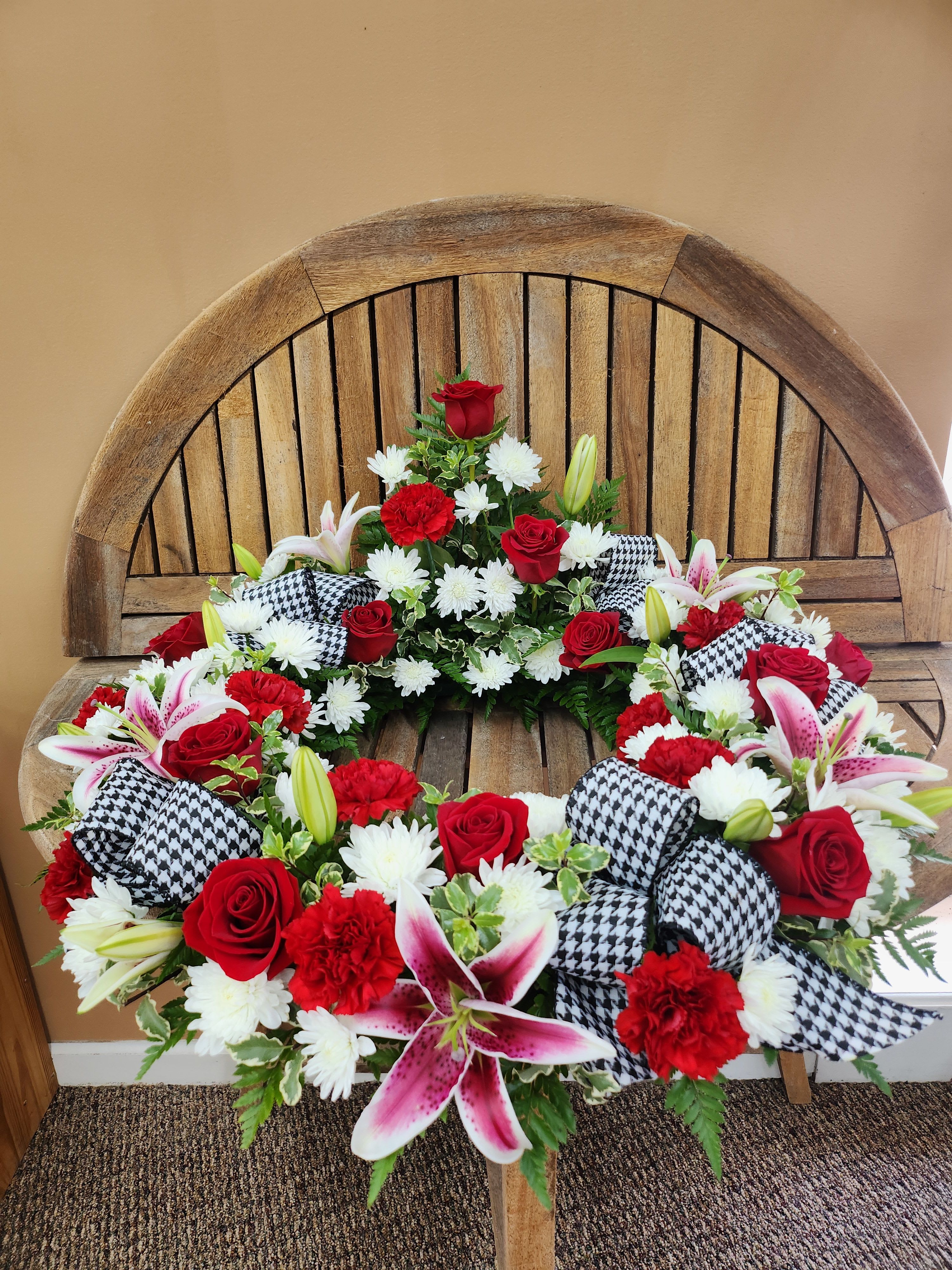 Urn Wreath In Reds And Whites With Houndstooth Ribbon - Urn wreath in reds and whites with Houndstooth ribbon. CHERUB NOT INCLUDED.