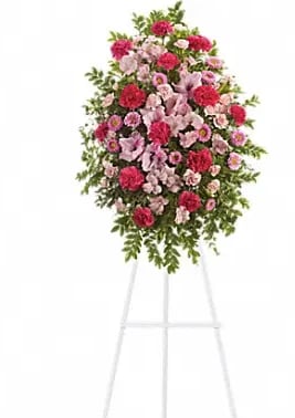 Pink Tribute Spray - With a bounty of lovely pink flowers and simple greens this pretty spray lets you express your sympathy beautifully.