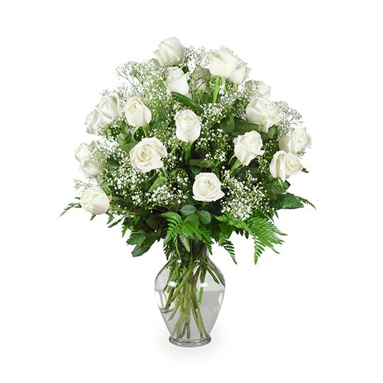 Grand Gesture - Pure white roses are arranged with buds of baby's breath in this lush and full gesture.  This piece is ideal for any type of service, especially for a visitation or memorial service.