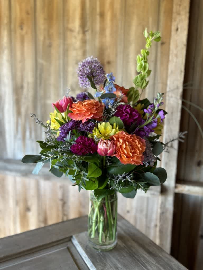 Moey's Country Posy Moey's Country Posy - A beautiful gathering of bright and colorful blooms to make your loved one feel special