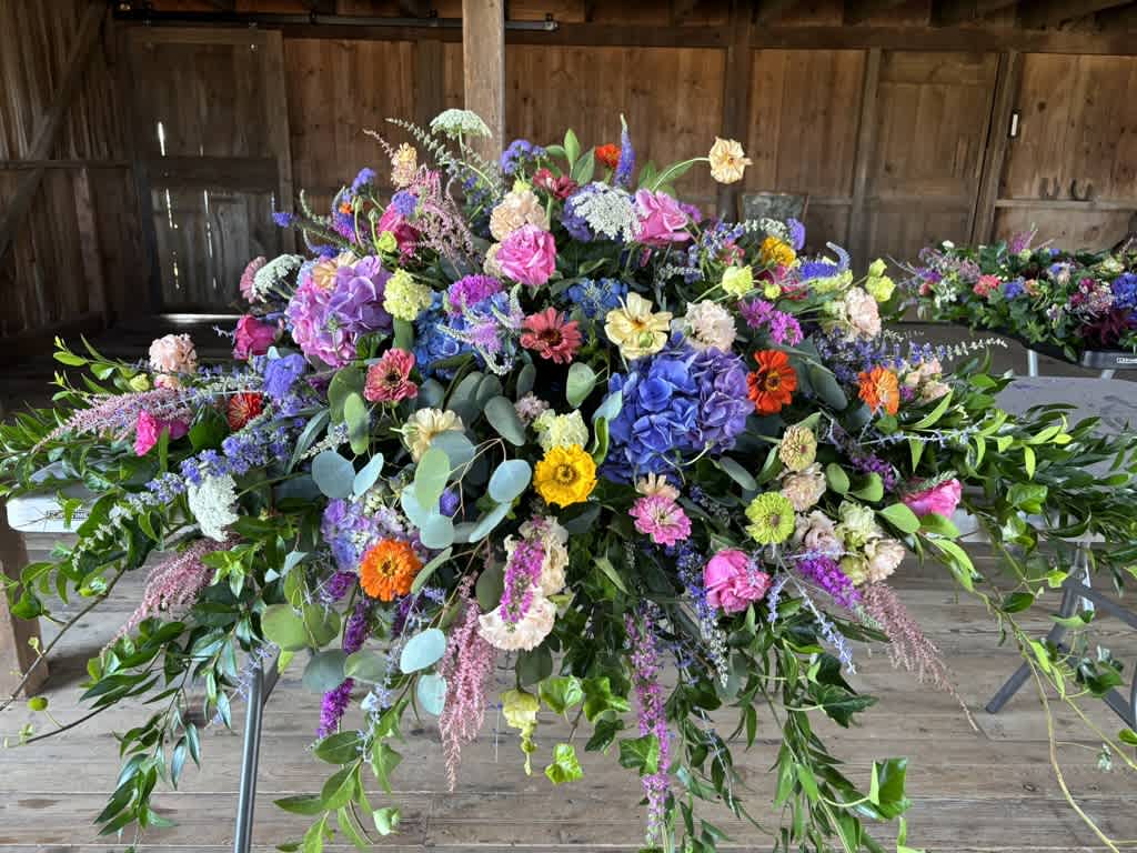 Summertime memories Memory Casket Spray - Summer garden flowers in a bright and colorful palette will be a most fitting tribute to your loved one