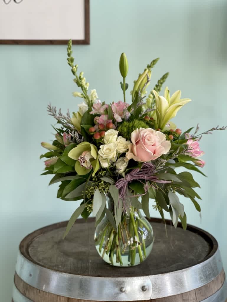 Renee's Garden Renee's Garden - A beautiful vase to include roses, lilies, spray roses, alstromeria, snapdragons, orchid blooms and hypericum berries in shades of pinks, whites and greens