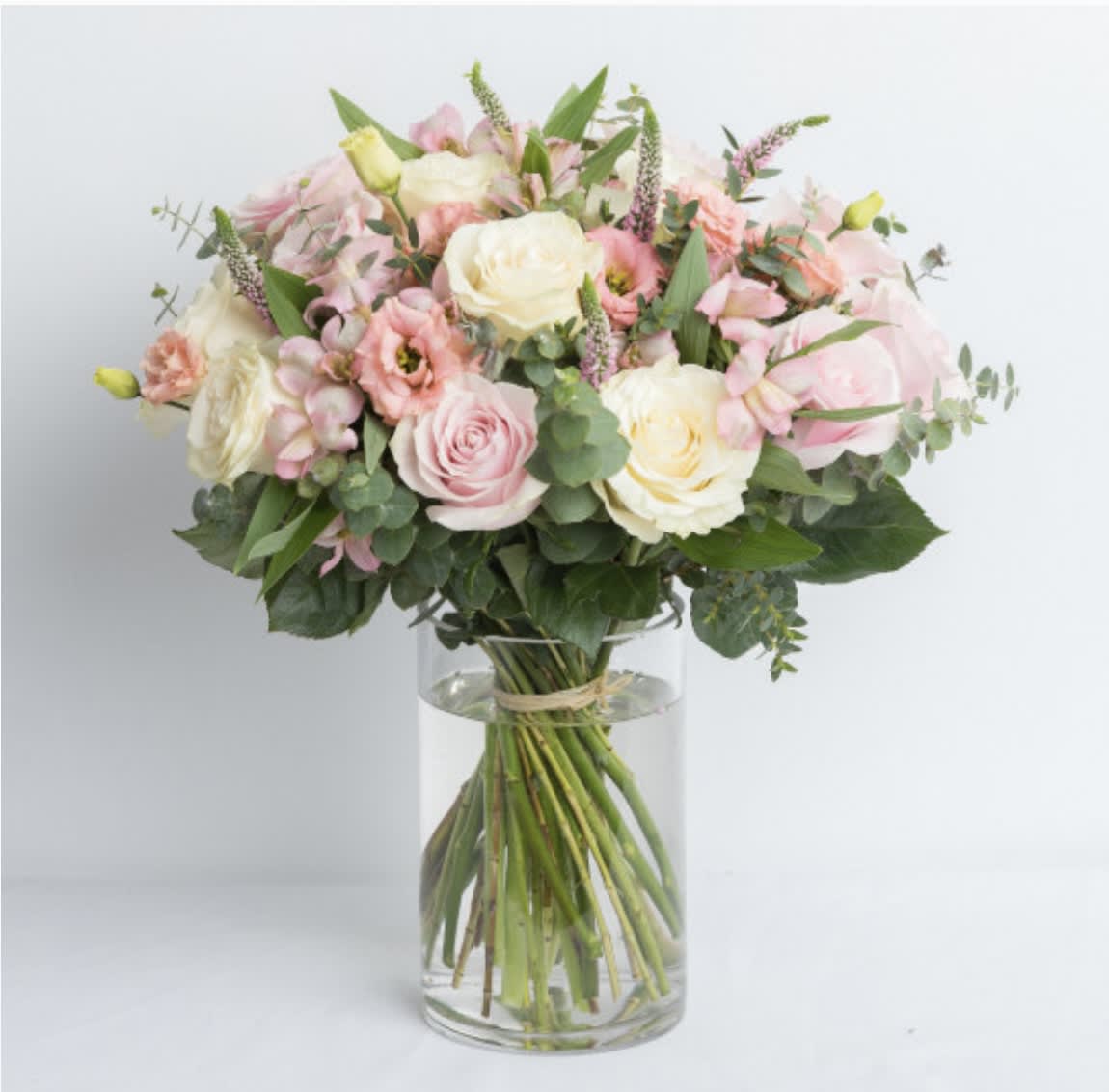 Helena - Irresistible blush bouquet for a sweet soft dream. With white and pink roses, pink alstroemeria and lisianthus, pink veronica, baby blue eucalyptus.