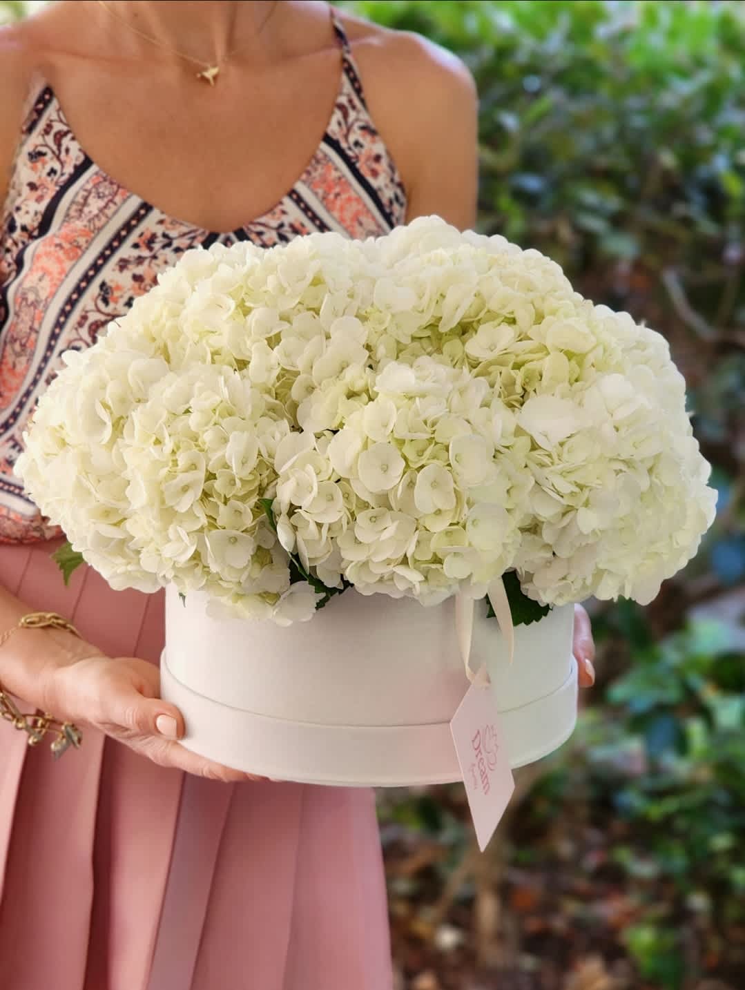 Little Fluffy Clouds - If you want to express your most tender feelings, then, by the way, a bouquet of white hydrangeas is perfect. Such a bouquet will be the best decoration for any holiday and room, office.   Disclaimer: IMAGES PROVIDED ARE ALL IN DELUXE SIZE. Photos and visual presentation of the products represent an overall style, look and feel, which we may not be able to identically replicate in some instances.