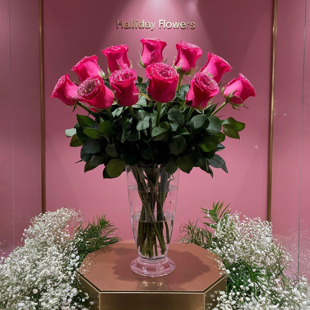 Dozen Hot Pink Long Stem Roses Dozen Hot Pink Long Stem Roses - Hot Pink Roses arranged in a wonderful clear vase good for a birthday, anniversary or and occasion.