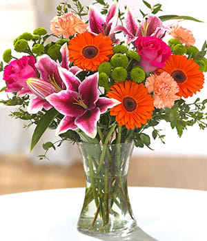 Vibrant Orange Gerbera Daisies, Pink Lilies, Carnations And More - This gorgeous nice arrangement is perfect for every occasion!
