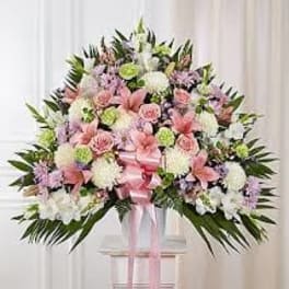 Pink, White And Green Pastel Funeral Basket - These soft pastel colors are arranged in a traditional design to send thoughts of comfort.
