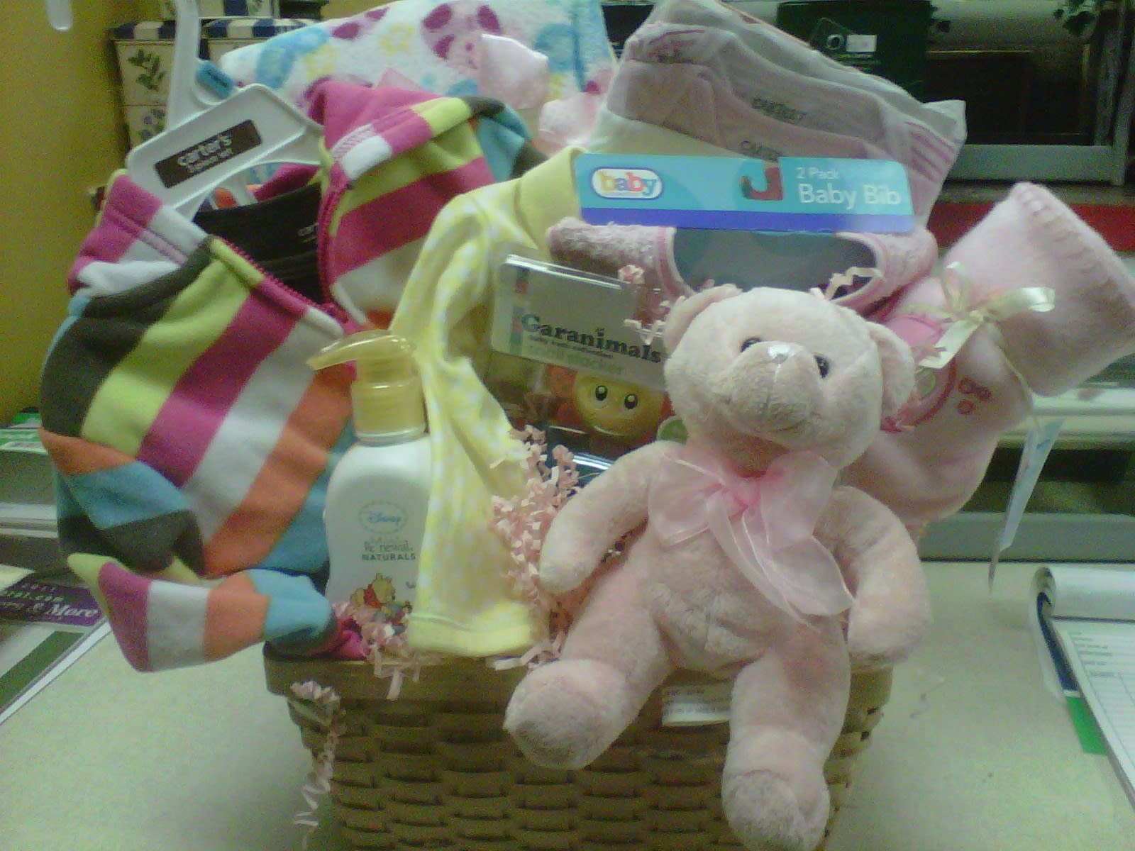 Baby Girl Gift basket - So much fun for the New Mom to receive a gift basket filled with lots of little gifts for baby girl. Every basket is made special for each recipient. We use quality clothing, plush, lotions, bibs, blankets and more. This is the gift they will love to get and it keeps giving!