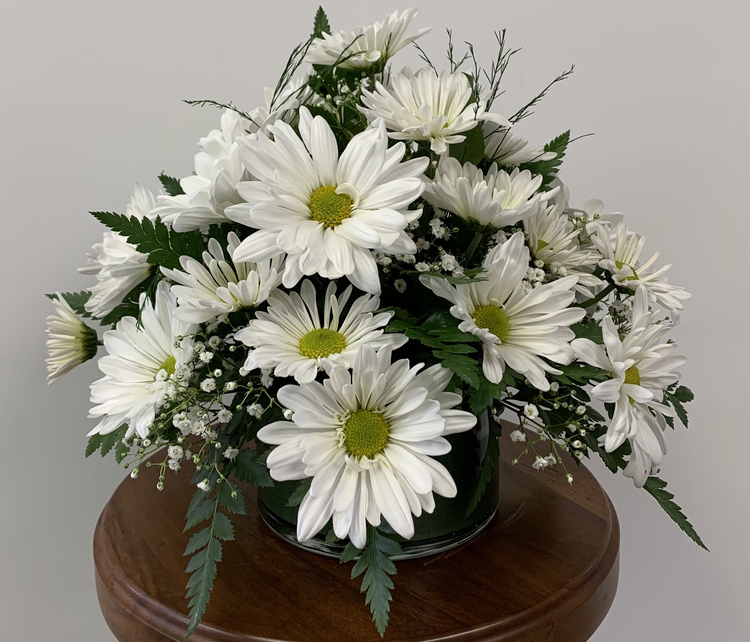 Daisy, Daisy! - A bouquet of daisies and baby's breath. Available in white, yellow, or lavender.