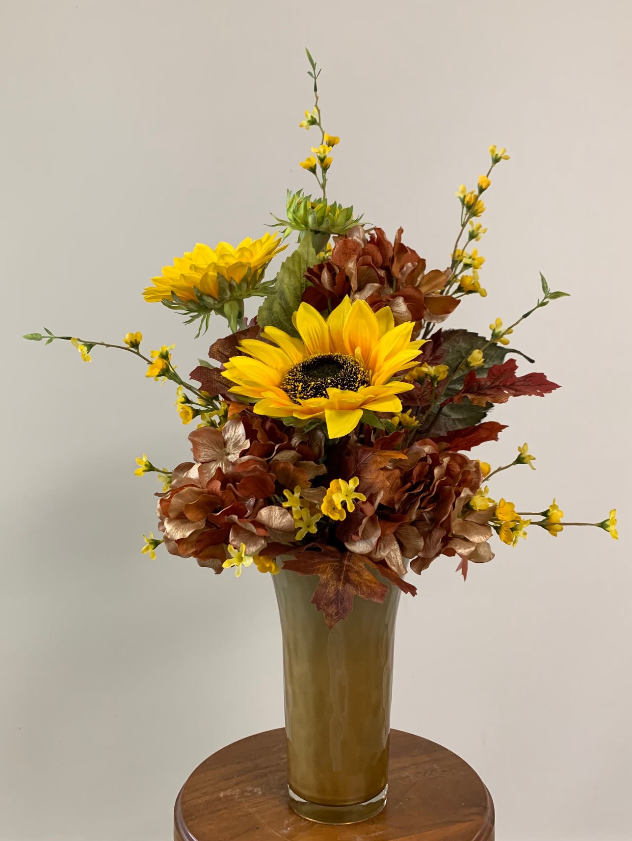Silk arrangement08012203 - Gold vase filled with silk sunflowers, browns and yellows. Three-sided