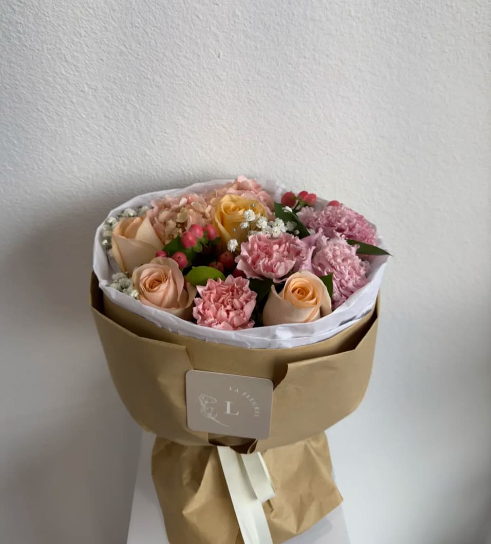 Candy Bouquet - Our hand tied bouquet comes without a vase which makes it perfect for a recipient who loves to arrange flowers on their own or who already has a stellar vase! Bouquet wrapped in brown paper   Perfect for any occasion.