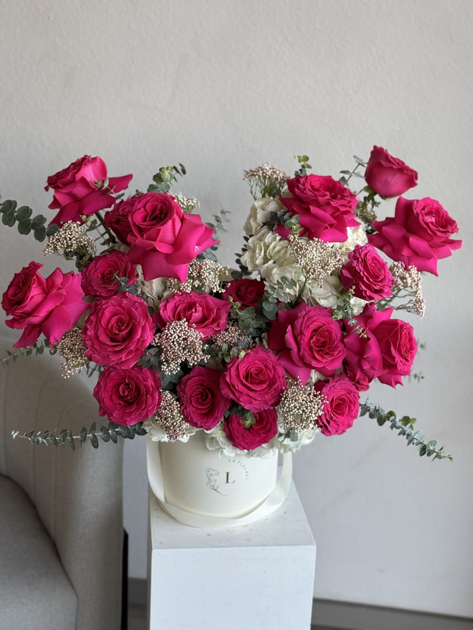 Hot Pink roses Mix arrangement - Experience the fiery allure of our Hot pink arrangement, where hot pink roses take center stage in a captivating display of elegance and vitality. Each velvety bloom exudes warmth and intensity, perfectly complemented by lush green foliage that accentuates their striking color. Whether adorning a special occasion or simply brightening your day, this arrangement is a testament to the power and beauty of passion