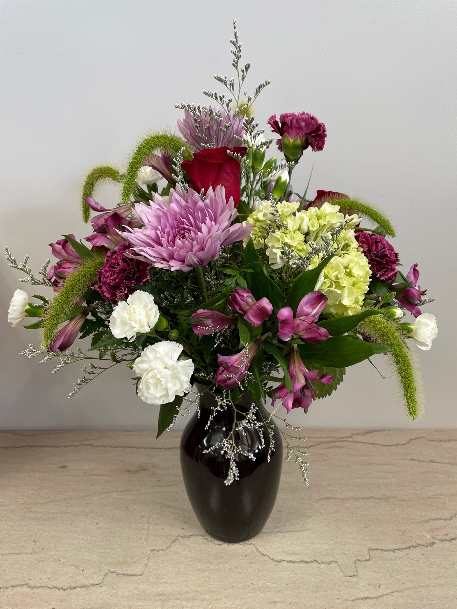 Lovely Devotion Lovely Devotion - A favorite in shades of lavenders, greens and white is the perfect choice to show someone how much you care. The perfect way to say I'm thinking of you!