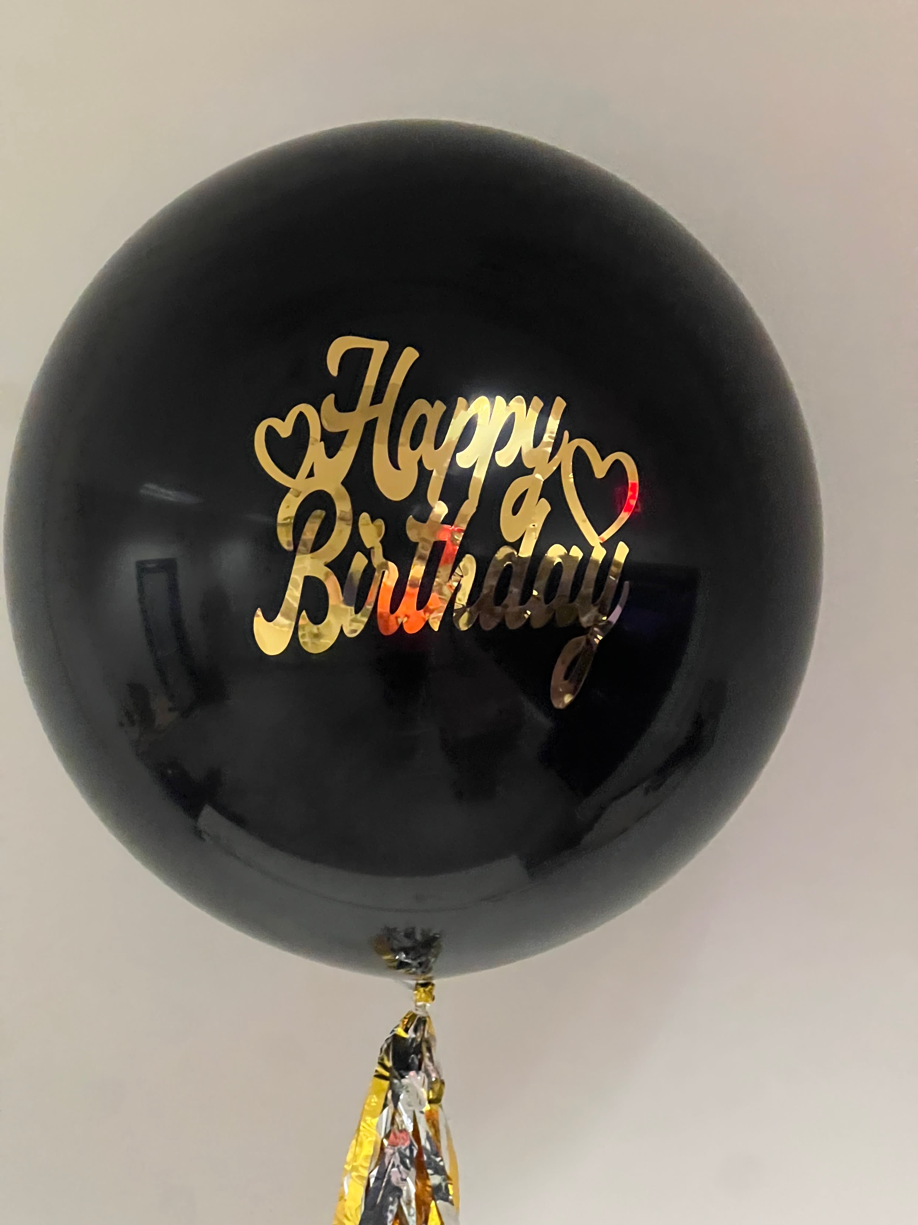 Large Balloon - Make a statement with our single large balloons featuring custom writing. These oversized balloons are perfect for personalizing your celebration with a special message, name, or date. Available in a variety of colors and styles, they add a unique and thoughtful touch to any event, from birthdays and weddings to corporate gatherings and milestones. Whether you choose elegant script or bold lettering, our custom writing transforms these balloons into memorable keepsakes, ensuring your message is seen and cherished by all.