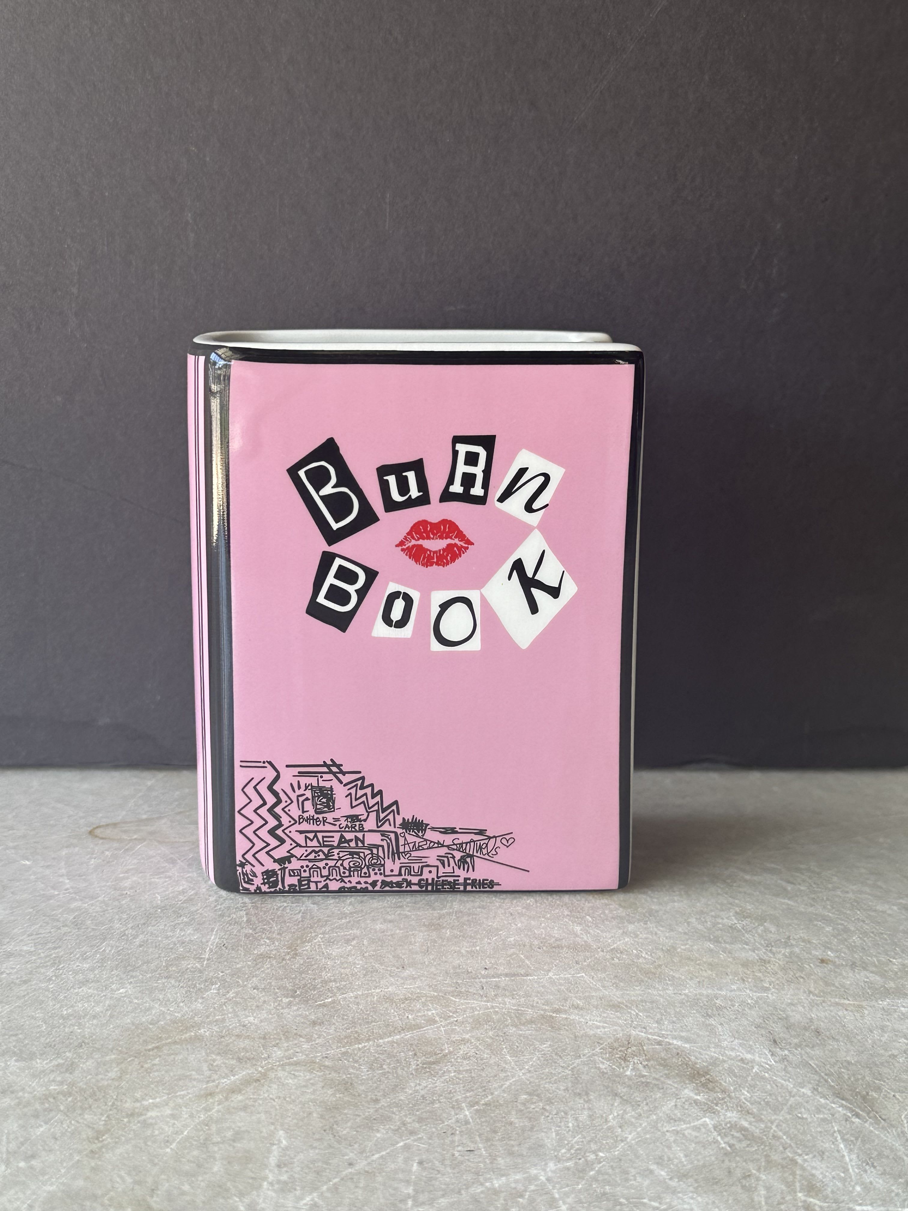 Mean Girls Burn Book Vase Mean Girls Burn Book Vase - Lush mound of seasonal floral with greenery in our MEAN GIRL BURN BOOK vase. Vase Dimensions: 4 x 5