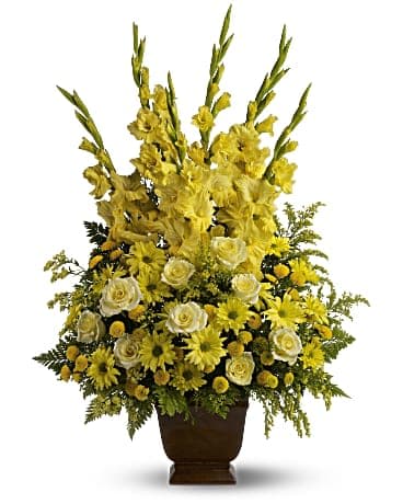 Sunny Memories Sunny Memories - Celebrate your sunny memories of someone special with this tall funeral floral arrangement, presented in a graceful urn. The sunny yellow flowers are a classic statement of never-ending friendship and love.