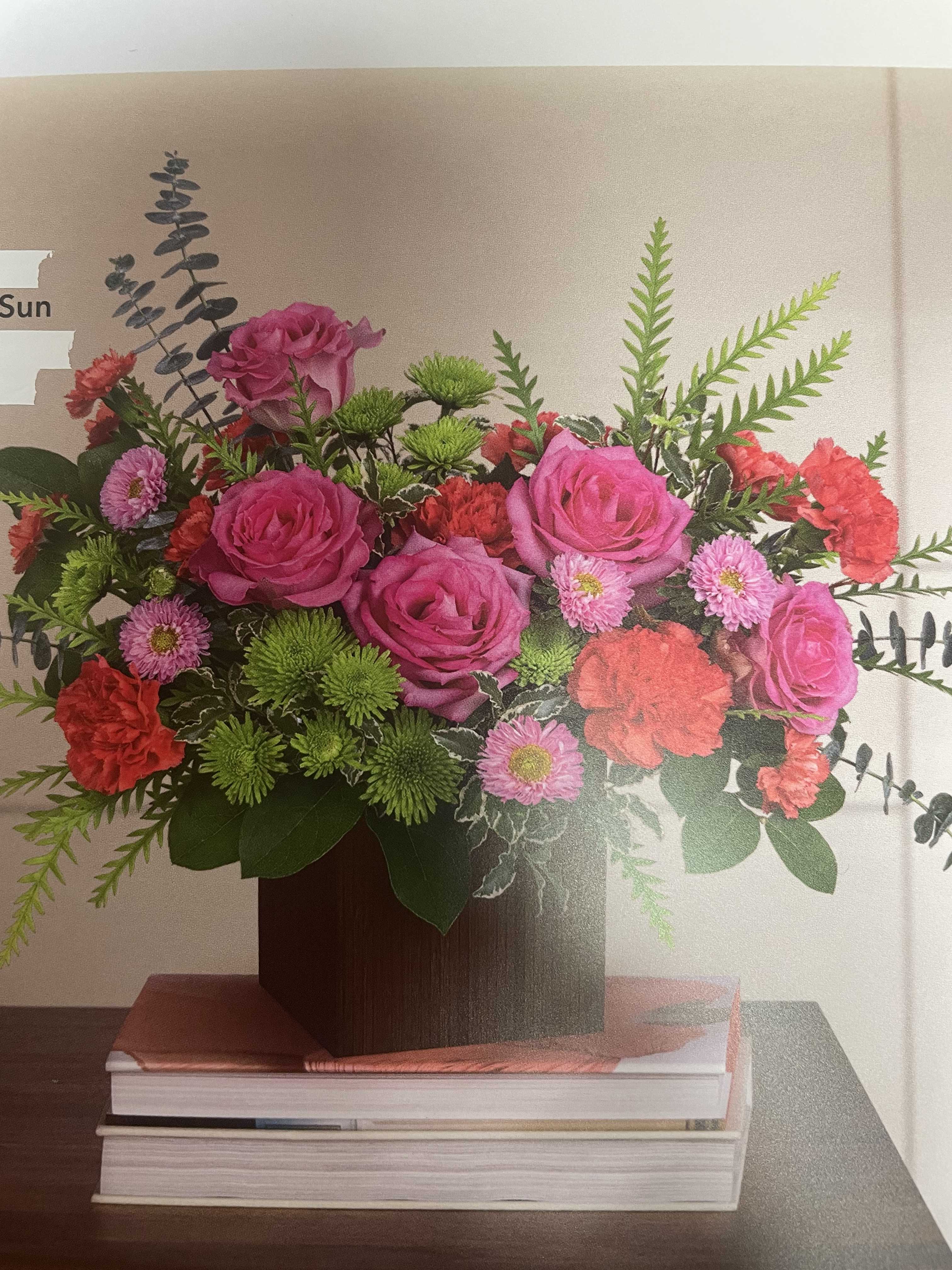 Bookworm Roses - We call this bookworm Roses because it is a great bouquet for your graduate who are off to college or new adventure.  But, it is not limited to that.  You can give this to someone special who loves to read.  This bouquet contains roses, green and pink button flowers, and foliage.  We can custom make it as per customer specification. For custom price orders, please call the store.  NOTE: Seasonal flowers and foliage are subject to substitution.  
