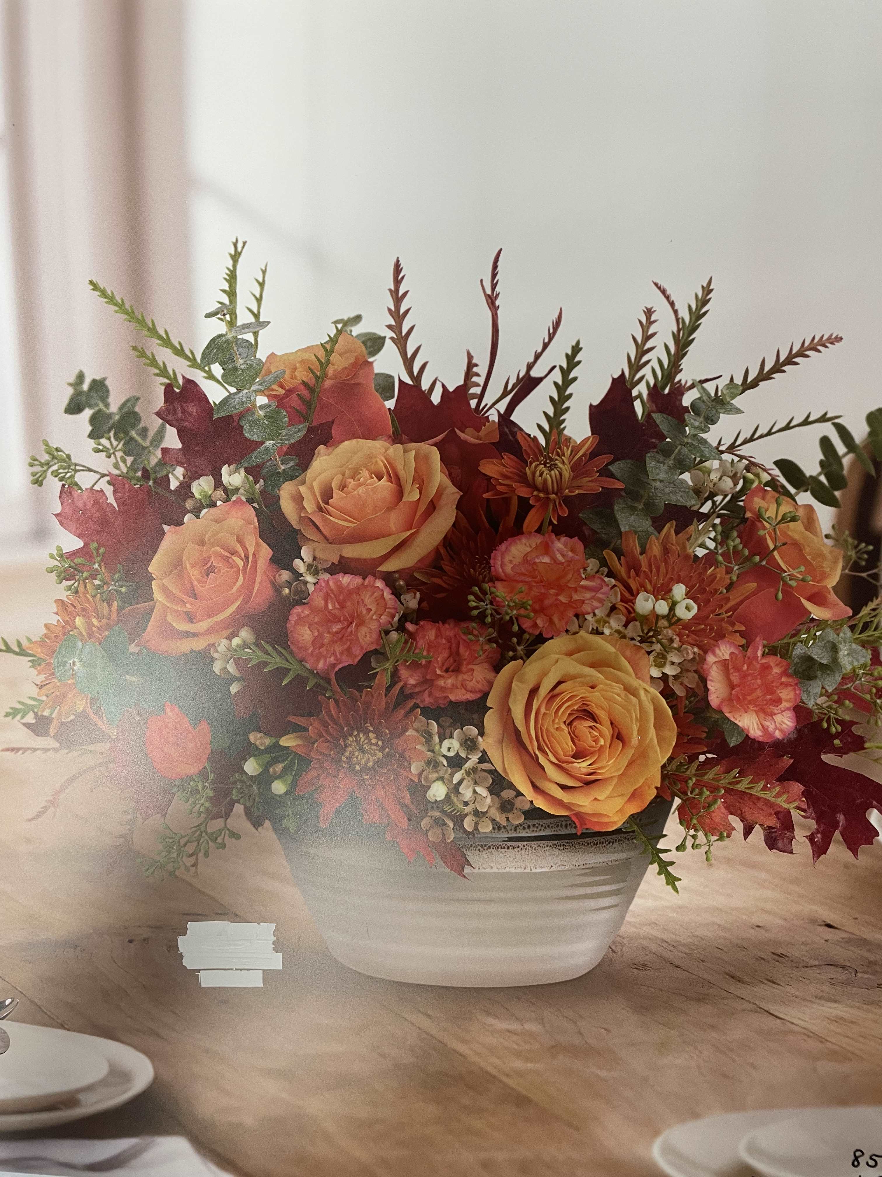 Fall Beauty - Great fall bouquet for your Thanksgiving Day.  Contains: Roses, carnation, mms, fall foliage, and others.  Seasonal flowers and foliage are subject to change.  Please call the store for any custom made arrangements or bouquet. 