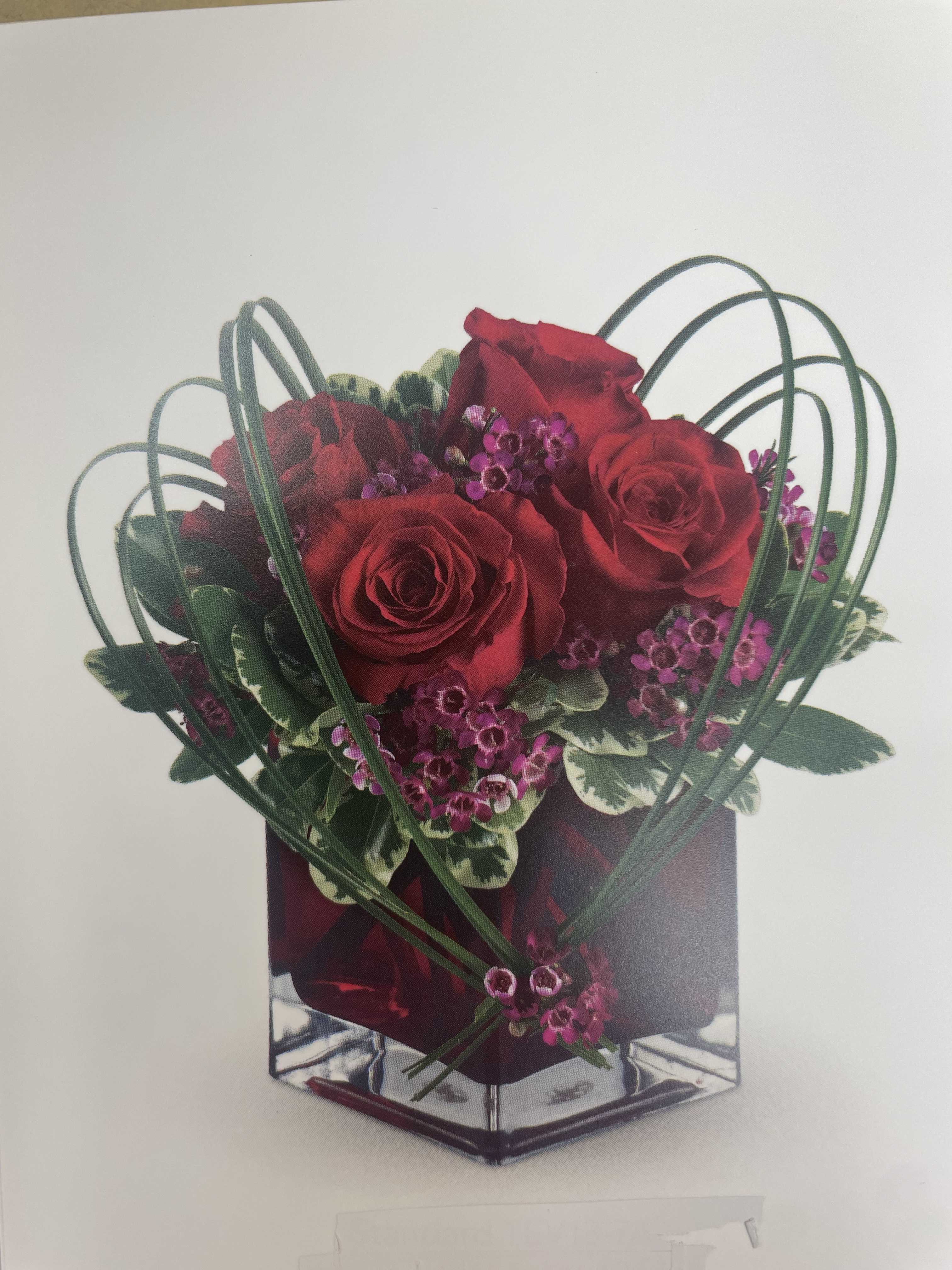 Sweet Smile Bouquet - This is great arrangement for Valentine's Day.  Flowers and foliage are roses, waxflower, lavender, variegated bear grass. We have premium and deluxe custom made for this arrangement.  Please call the store for custom made arrangement.  Seasonal flowers or foliage maybe will be substituted.   