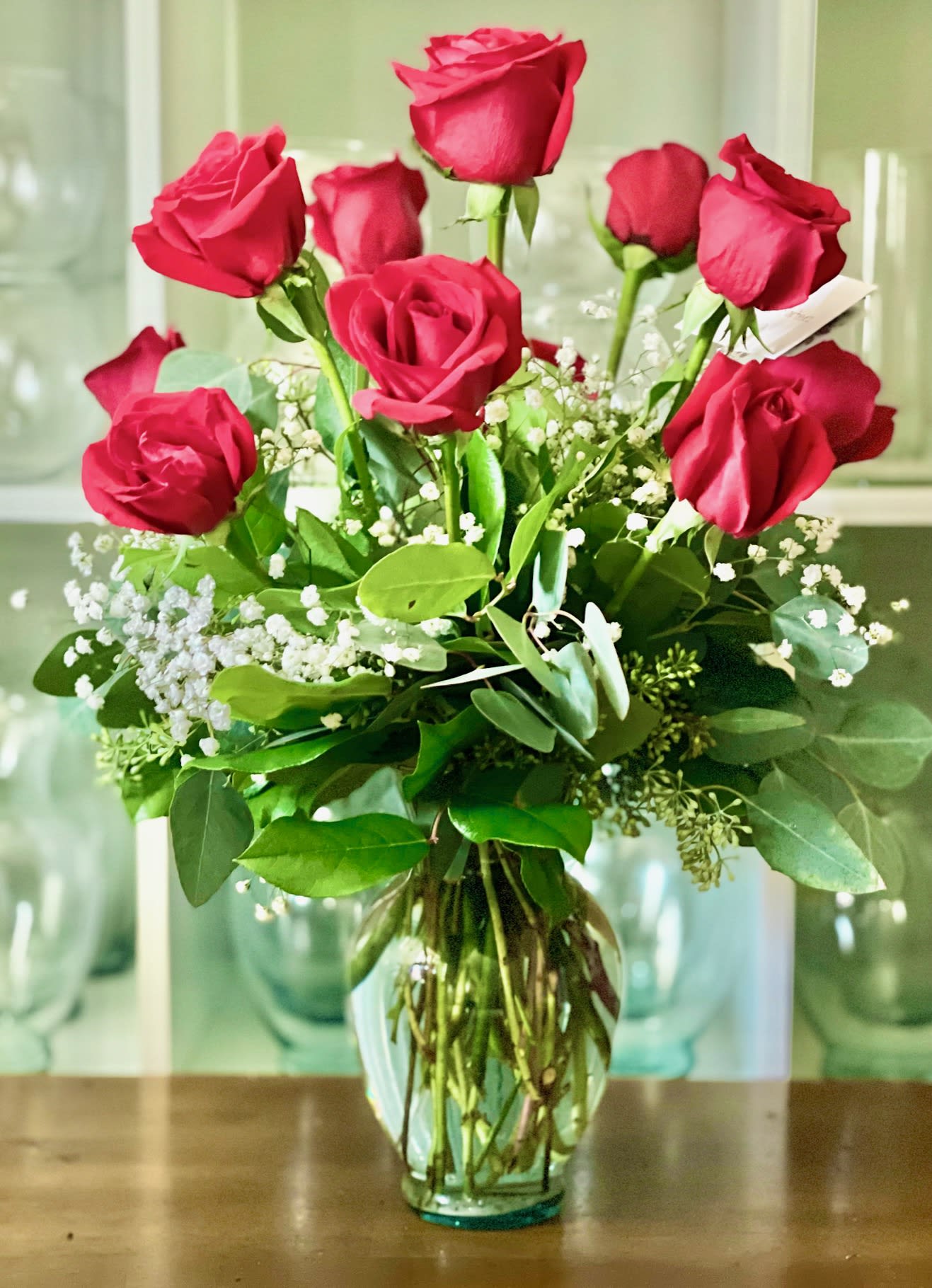 My Love My Love - Lovely arrangement with the classic combination of one dozen Premium red roses and babies breath in a 9" vase.