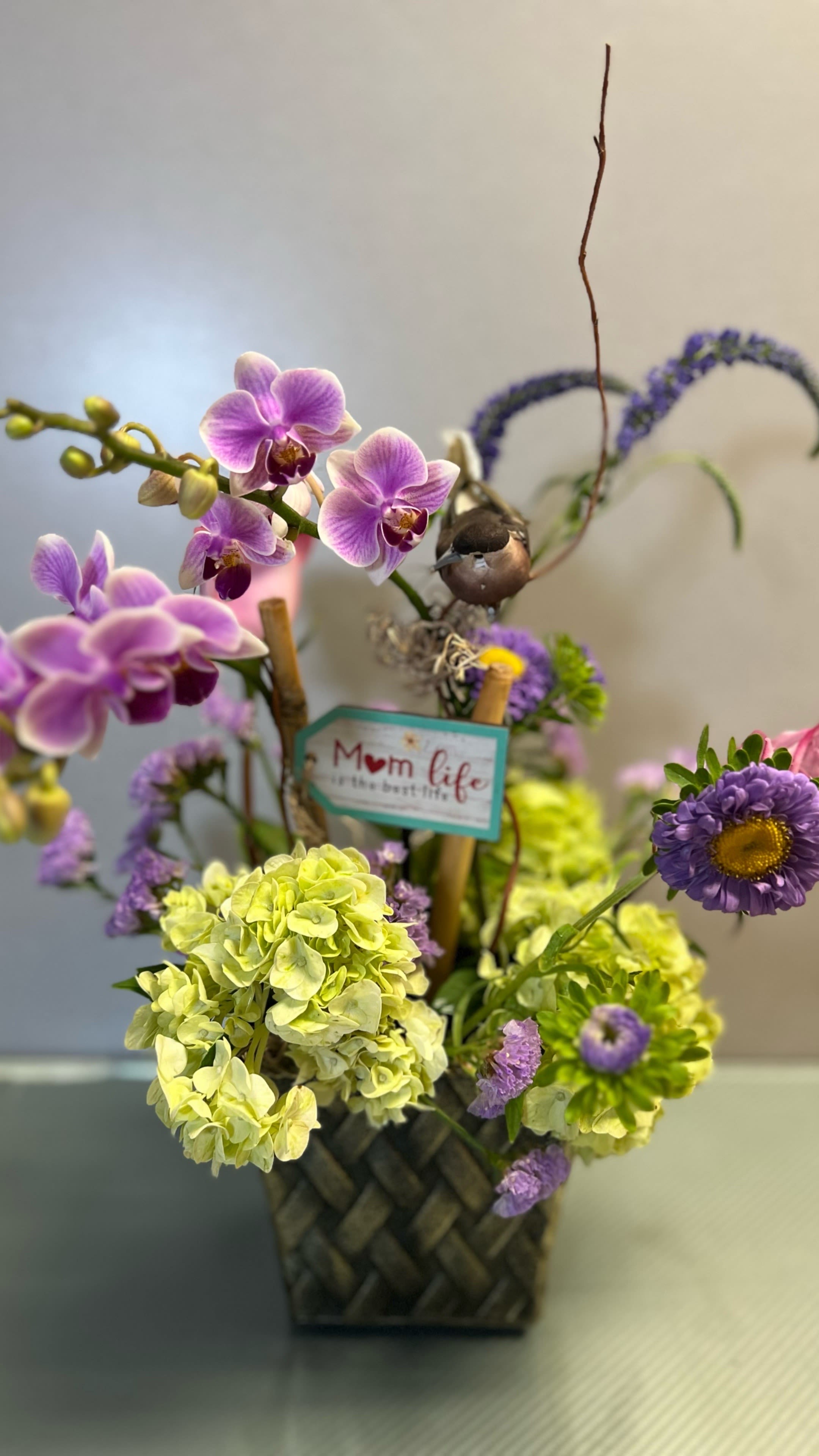 Orchid Breeze - Orchids and cut fresh flowers  AS SIMILAR AS POSSIBLE Substitution based on season, flowers availability or any unforeseen or uncontrollable circumstances 