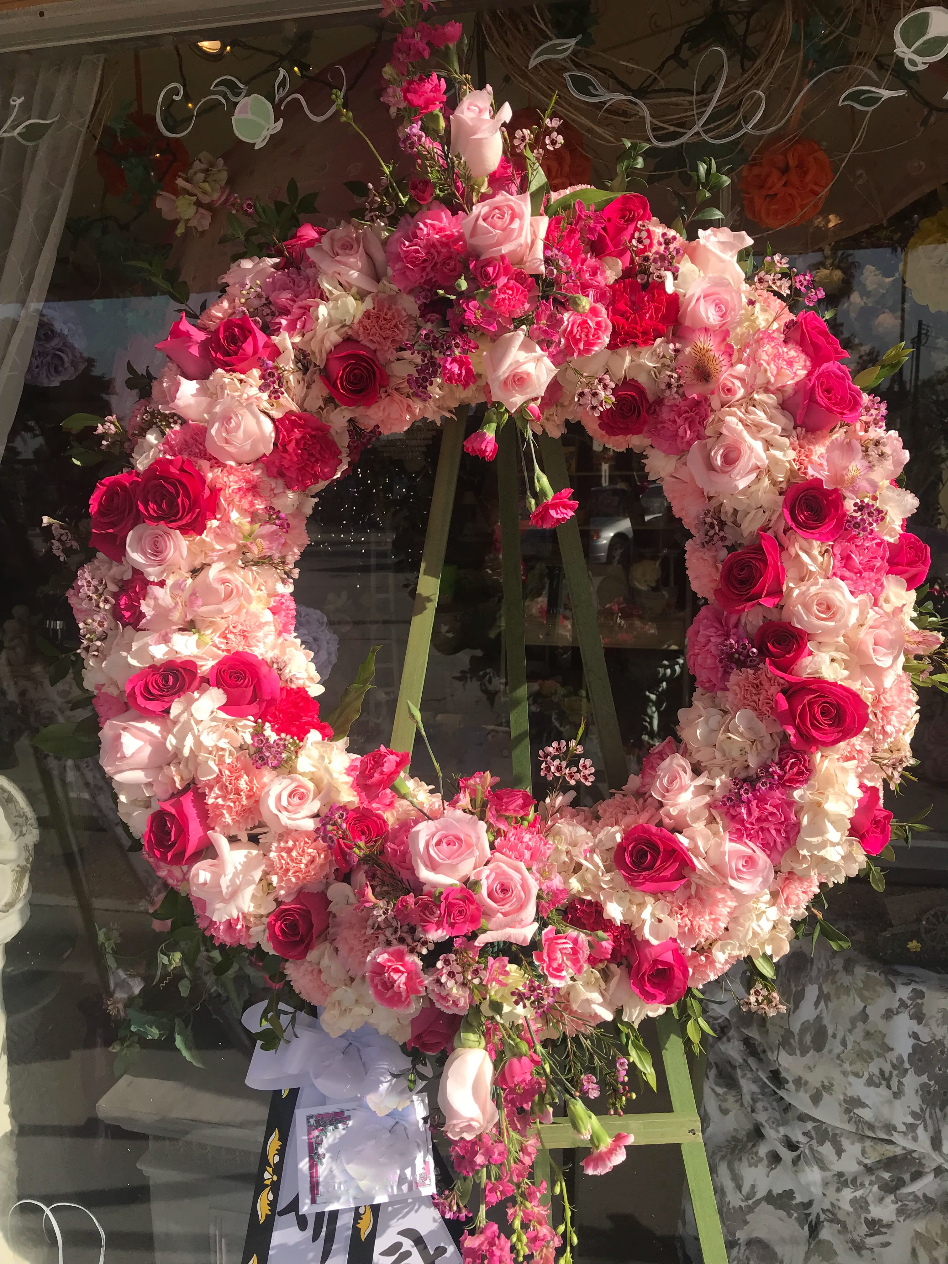Circle of Love - Abundance of fresh blooms in a beautiful easel arrangement.