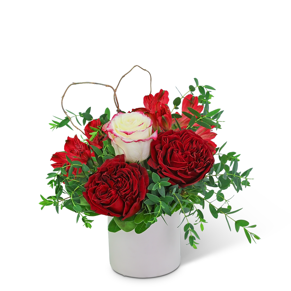 True Romance - This gorgeous design is hand-arranged by our professional floral designers and delivered in an on-trend white vase. The rich, romantic colors of True Romance are sure to melt the heart of your loved one. Beautiful ruffly roses, alstroemeria, and premium foliage are artfully arranged with a natural heart accent nestled in. Flower delivery has never been easier or more appreciated. Whether you are looking for a birthday, anniversary, or valentines day gift, we have flowers that are sure to fit the occasion!