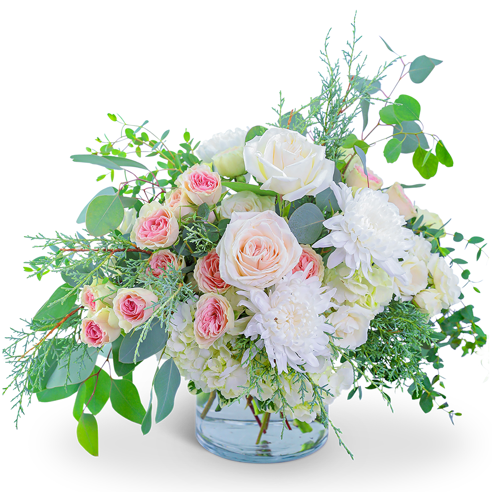 Wintertime Bubble Bath - Awaken the senses as you walk into your own romantic floral fantasy! Traditional roses, contemporary mums, and playful hydrangea mix to create a stunning bouquet! Wintertime Bubble Bath is bursting with blossoms and arranged in an eye-catching clear glass vase, accented with premium foliage. A shop favorite, this timeless beauty is perfect for any occasion!