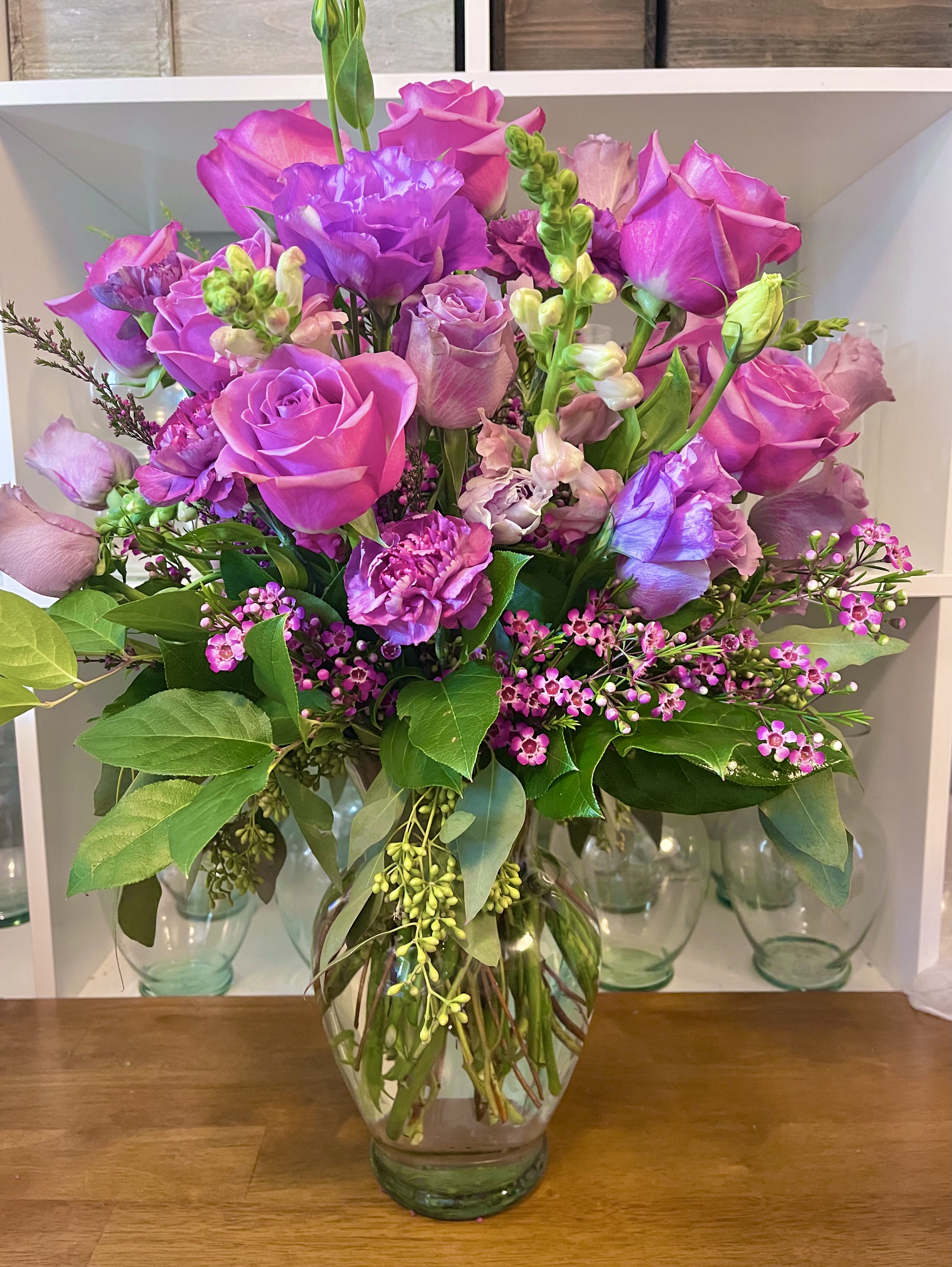 Violet Dreamland Violet Dreamland - Beautiful purple and violet flowers in a clear glass vase.