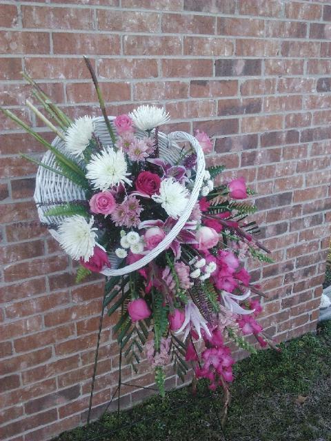 Fireside Basket Standing Spray Fireside Basket Standing Spray - A contemporary tribute, combining the warmth of a fireside basket with the drama of an easel display. Featuring gladiolus, larkspur, spider mums. stargazer lilies and more.