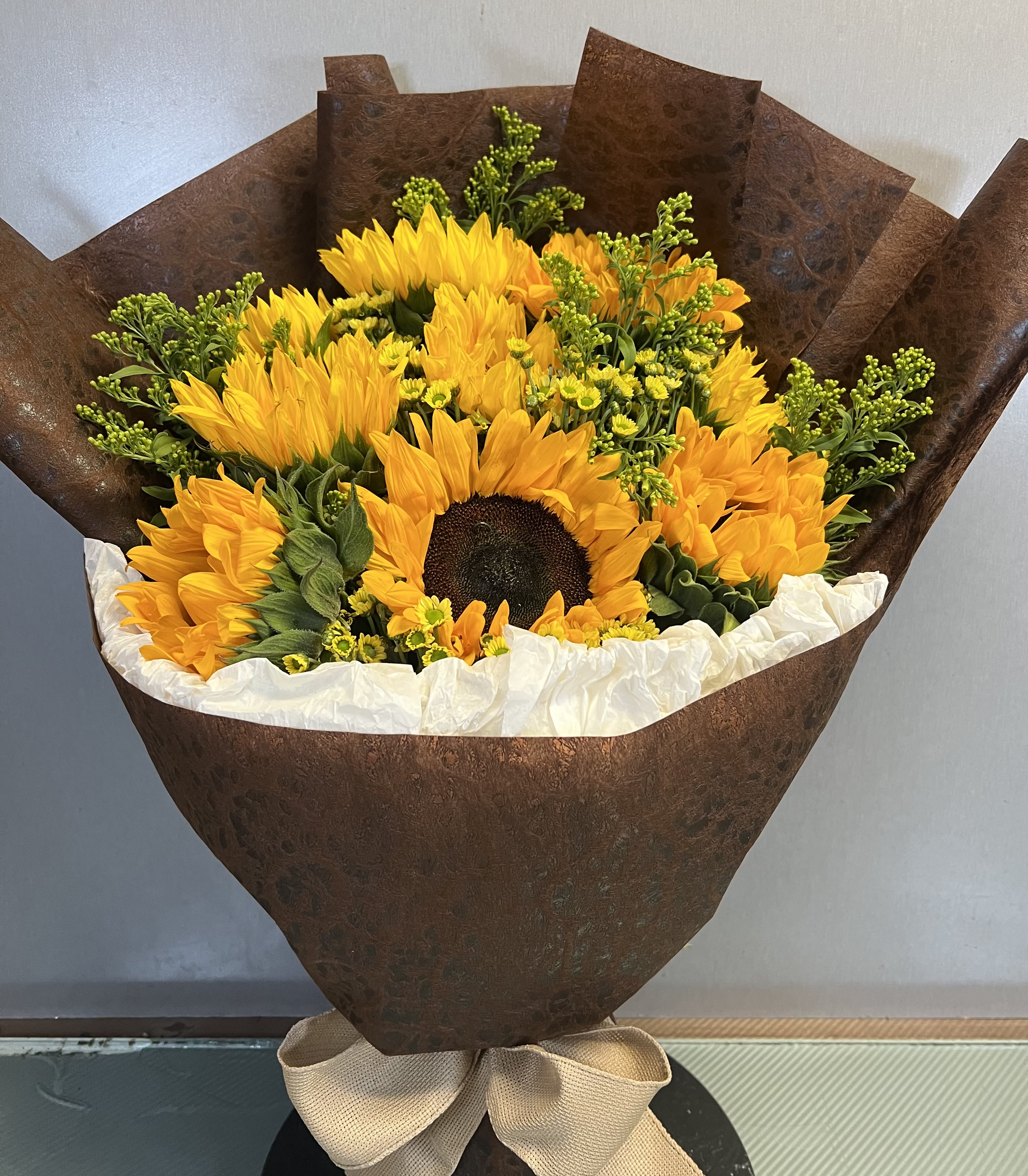 Sunlit Embrace - Wrapped Sunflowers AS SIMILAR AS POSSIBLE  Substitution based on season, flower availability, or any unforeseen or uncontrollable circumstances 