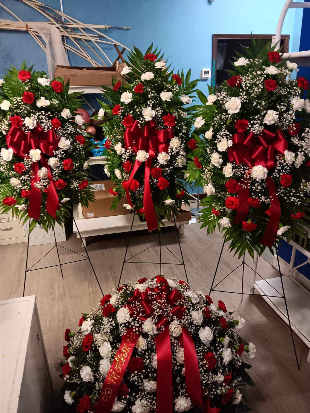 4pc Family Funeral Set 4pc Family Funeral Set - 4pc Family Funeral Set with red and white carnations ties together with lush greenery