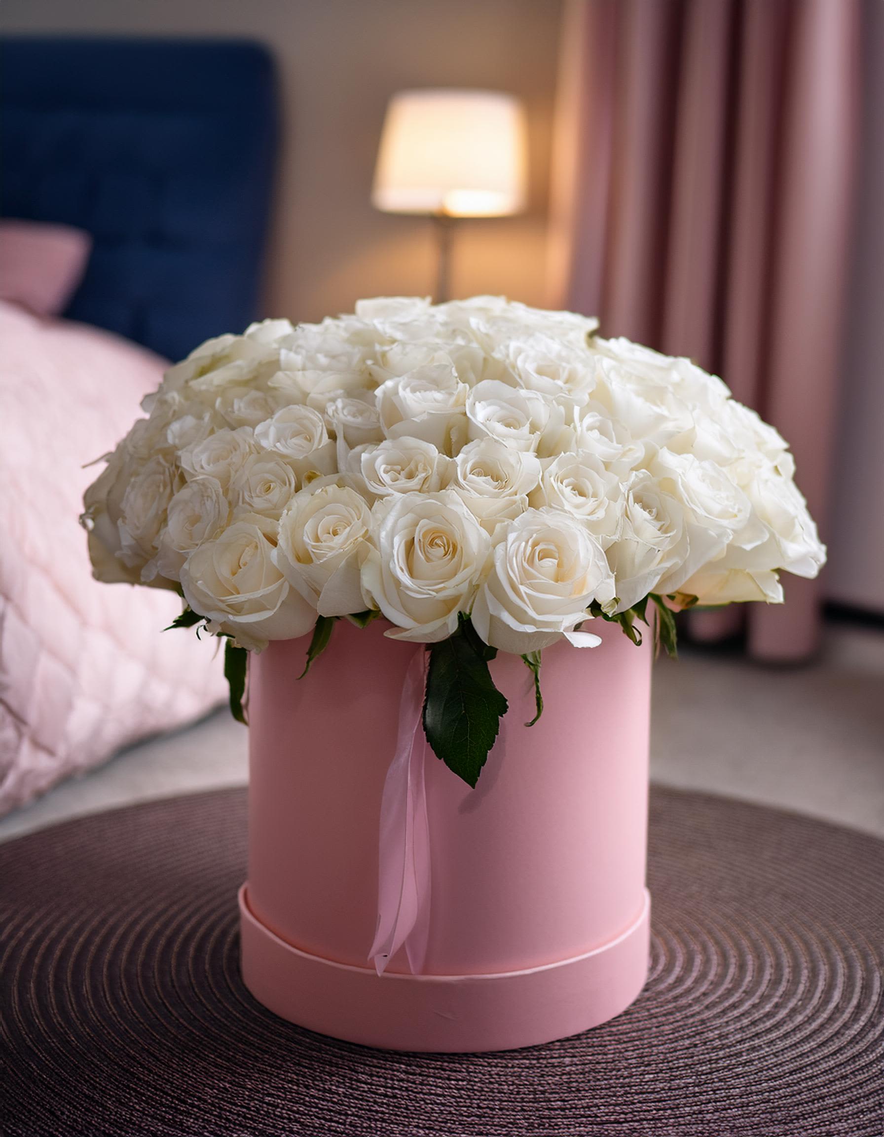 Sweetheart’s Serenade - Experience luxury with our stunning white roses, beautifully arranged in a chic hatbox. Ideal for any occasion, make your expression of love unforgettable with this elegant and unique gift.  Disclaimer: IMAGES PROVIDED ARE ALL 50 ROSES