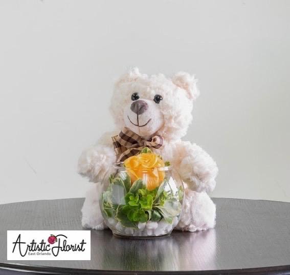 Dre Romantic Oasis Dre Romantic Oasis - Dre the bear is Huggins a stunning arrangement of hydrangeas and a rose floating in a bubble vase surrounded by decorative rocks.