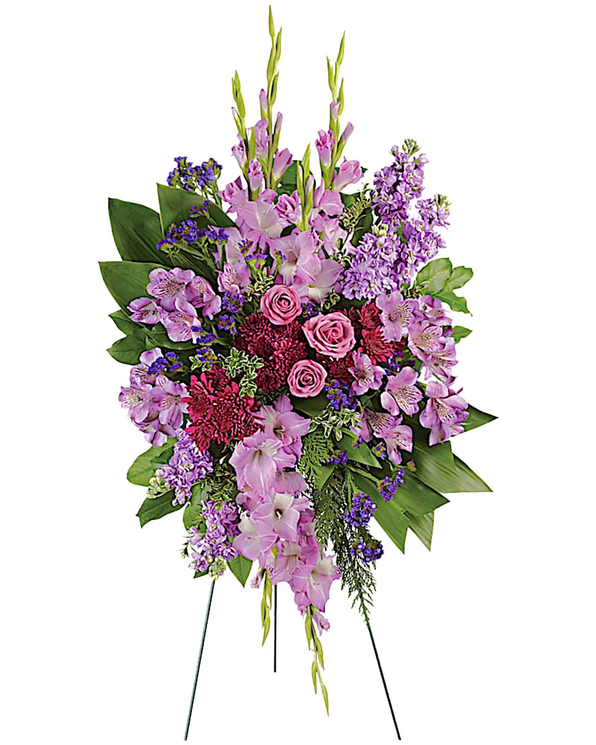 Lavender Reflections Spray - Take a walk through the garden of memories with this lush spray of lavender and purple blooms, accented with fresh green Ti leaves. It's a joyful expression of sympathy sure to be appreciated.  DETAILS This regal spray includes lavender roses, lavender alstroemeria, lavender gladioli, lavender stock, purple cushion spray chrysanthemums, purple statice, green Ti leaves, flat cedar, Oregonia and lemon leaf. A grand display appropriate for the funeral home, memorial service, or gravesite.  EASEL INCLUDED Orientation: One-Sided *If you would like to add a ribbon with a sentiment for an additional $10 each. Item #NF-1088  FLORIST-TO-DOOR Same day flower delivery on most orders placed online by 12 pm or 10 am on weekends PST.  BLOOM DETAILS Gladiolas Roses Cushion Mums Alstroemerias Statice Stock Greenery  The Standard Arrangement is approx. 43 1/2&quot;H x 29 1/2&quot;W (without stand) (SHOWN) The Deluxe Arrangement is approx. 46&quot;H x 32&quot;W (without stand) The Premium Arrangement is approx. 50&quot;H x 34&quot;W (without stand)  INSTRUCTIONS: 1.) Please have the business name of the funeral home, address &amp; phone number. 2.) Please have the first name &amp; last name of the deceased. 3.) Please have the start time of the services. 4.) If you would like for us to write a brief message on a small business card-size note, please have your message ready.  NINFA'S FLOWERS 2405 WHITTIER BLVD. LOS ANGELES, CA. 90023