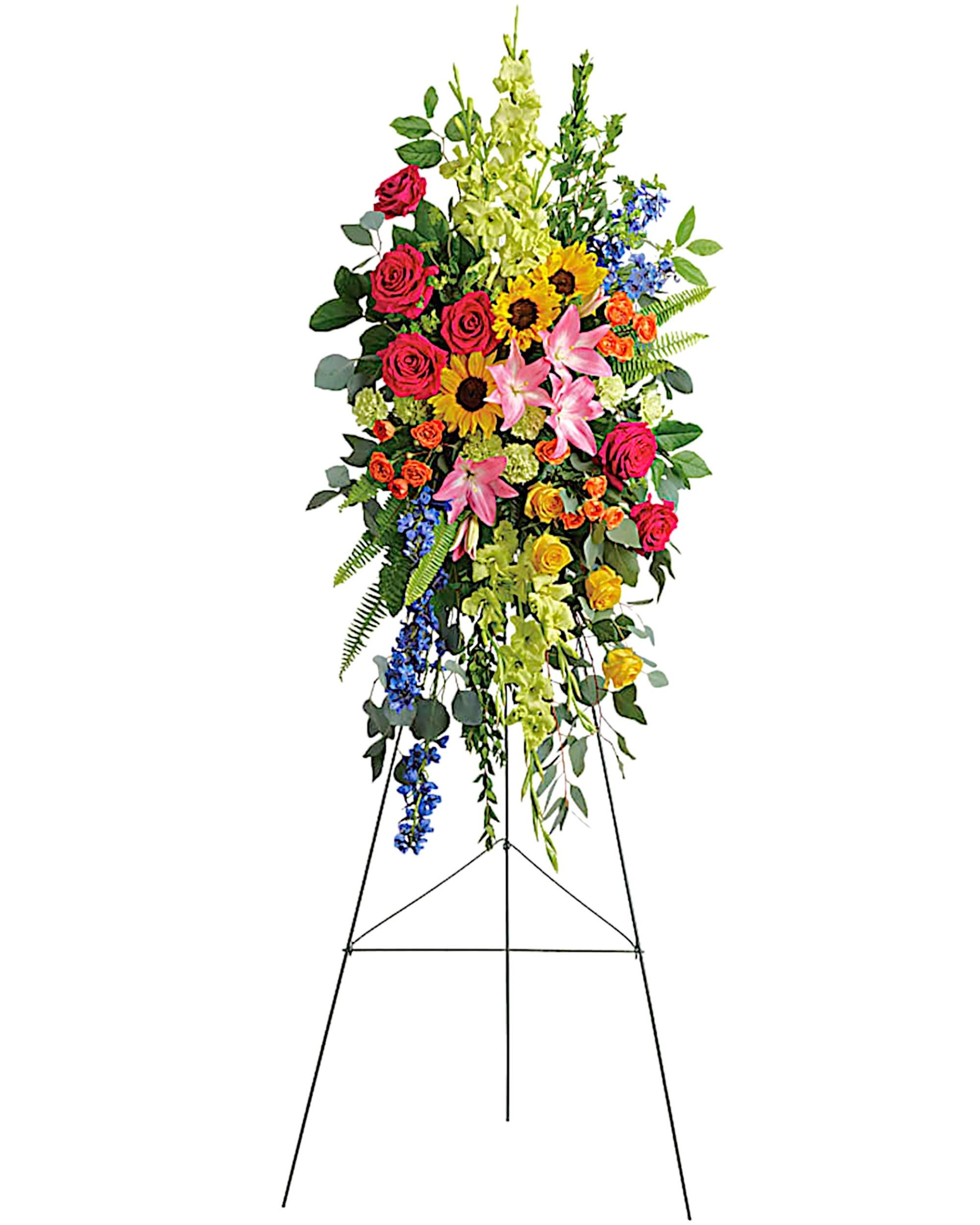 Love Lives On Standing Spray - A bold, bright tribute, this rainbow of blooms fills the room with a spirit of hope and joy. What a glorious celebration of a love that will live on forever. Appropriate for the funeral home, memorial service, or gravesite.  DETAILS This spray features hot pink roses, yellow roses, orange spray roses, pink Asiatic lilies, green gladioli, green carnations, medium yellow sunflowers, blue delphinium, bupleurum, myrtle, sword fern, silver dollar eucalyptus, and lemon leaf.   EASEL INCLUDED Orientation: One-Sided *If you would like to add a ribbon with a sentiment for an additional $10 each. Item #NF-1090  FLORIST-TO-DOOR Same day flower delivery on most orders placed online by 12 pm or 10 am on weekends PST.  BLOOM DETAILS Roses Spray Roses Carnations Mini-Carnations Gladiolas Delphinium Asiatic Lilies Sunflowers Greenery  The Standard Arrangement is approx. 52&quot; H x 25 1/2&quot; W (SHOWN) The Deluxe Arrangement is approx. 56&quot; H x 29 1/2&quot; W The Premium Arrangement is approx. 60&quot; H x 33 1/2&quot; W  INSTRUCTIONS: 1.) Please have the business name of the funeral home, address &amp; phone number. 2.) Please have the first name &amp; last name of the deceased. 3.) Please have the start time of the services. 4.) If you would like for us to write a brief message on a small business card-size note, please have your message ready.  NINFA'S FLOWERS 2405 WHITTIER BLVD. LOS ANGELES, CA. 90023