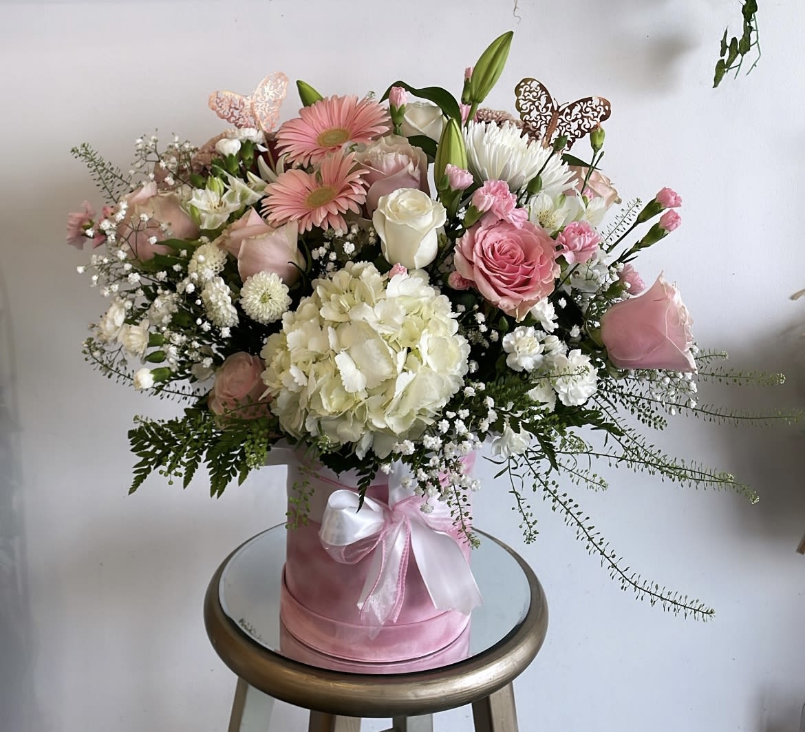 The Simply Serene Floor Basket   - Express your condolences in a genuine way with our Simply Serene Floor Basket. Our local florists understand that life is difficult during times of sensitivity. Each artisan takes great care in handcrafting this gorgeous arrangement of hydrangea, lilies and roses together to share your sympathies. 