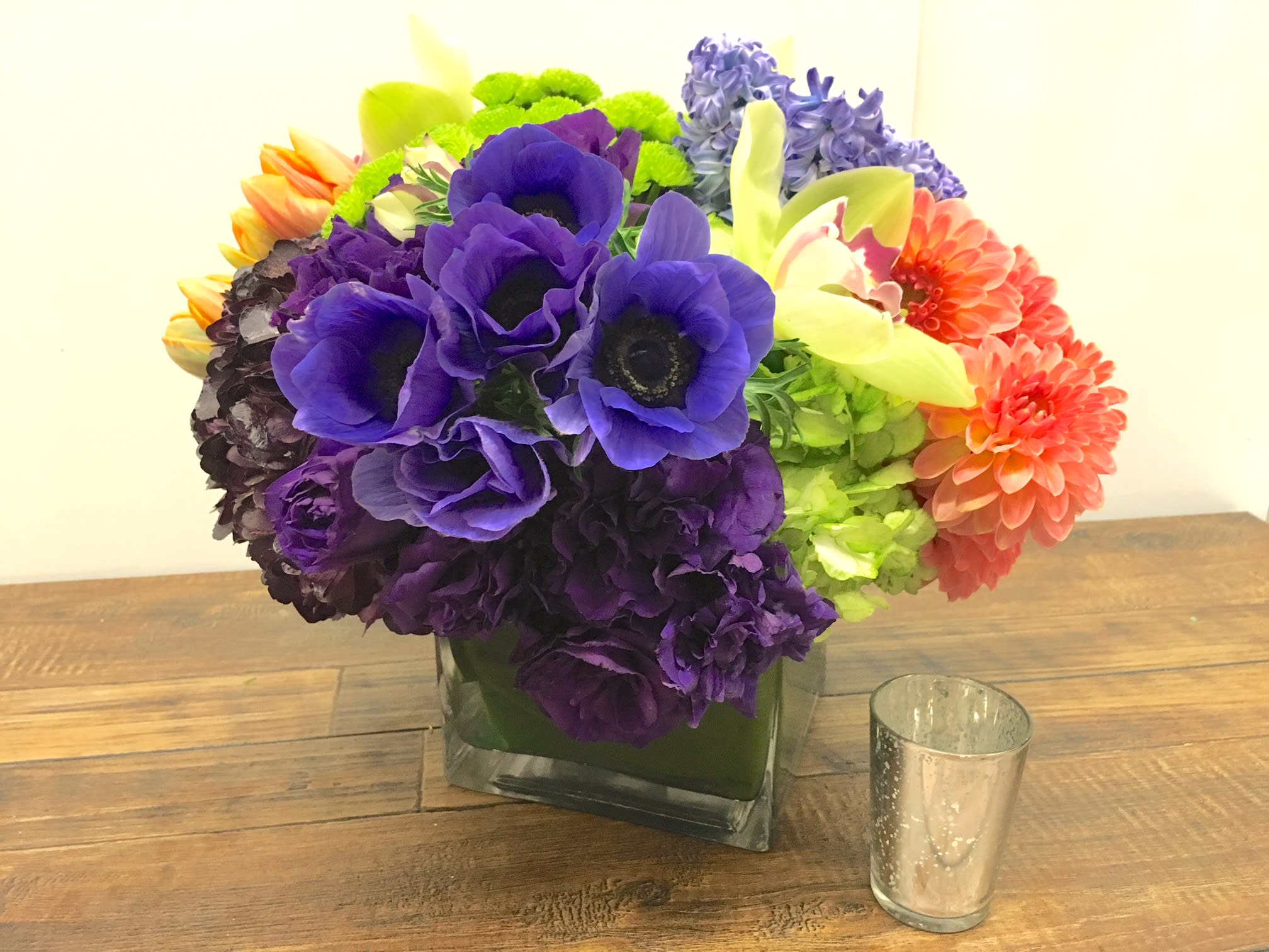 Color Me Mine - Here we present a colorful combination of anemone, dahlias, tulips, roses, pompoms, cymbidium orchids, lisianthus and hyacinth.  *Standard size is approximately 12&quot; x 12&quot;.